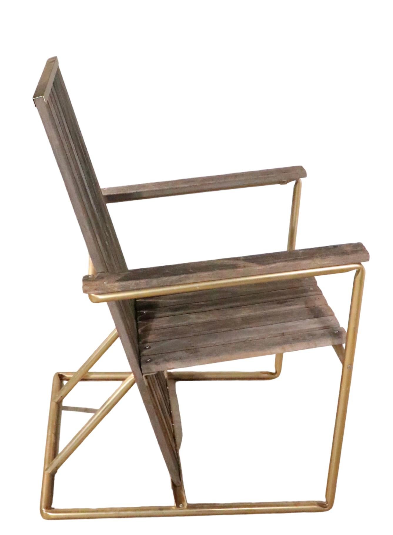 Chic architectural vintage 1970's lounge chair, having repeating wood planks, with an anodized aluminum gold tone frame. Design reminiscent of the classic De Stijl School, by Gerrit Rievtveld in an update casual modernist style. 
 The wood slats are
