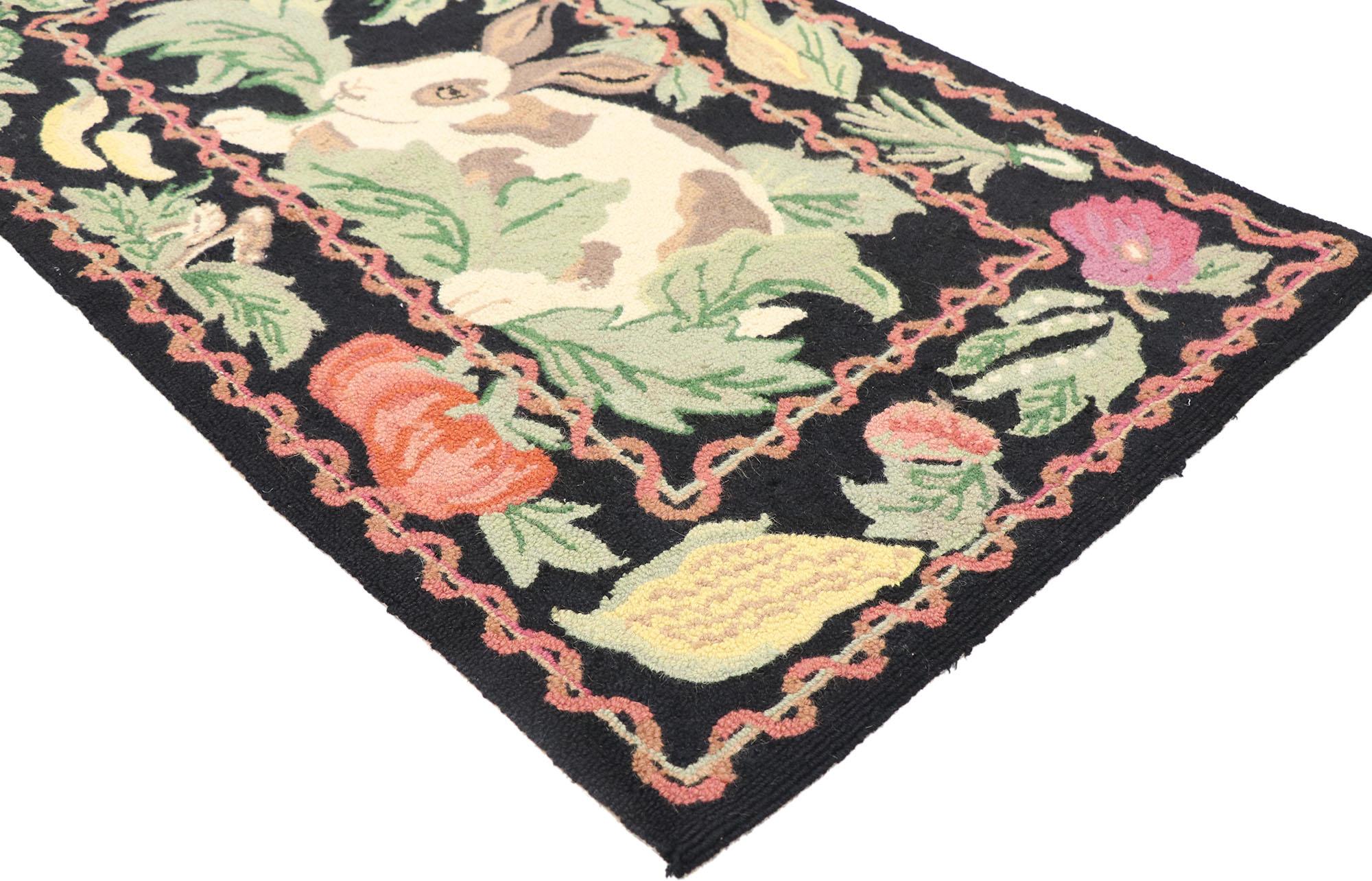 77854 vintage Garden Rabbit Hooked rug with French Country Cottage style 02'05 x 04'00. Warm and welcoming, this vintage garden rabbit hooked rug showcases a French Country Cottage style. The abrashed black field features a rabbit surrounded by a