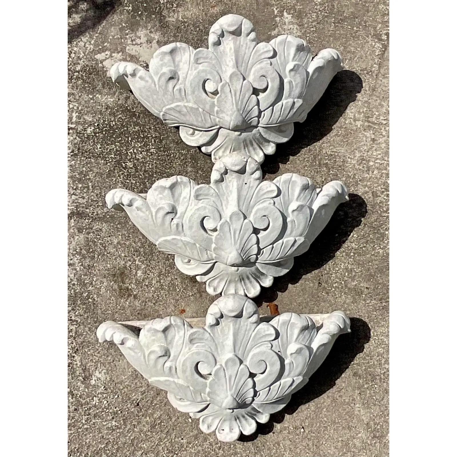 A fabulous set of three vintage Regency wall pockets. Made of a cast concrete with lots of room for your plants. Perfect for orchids. Perfect as is or paint a bright white for a fresh finish. Acquired from a Palm Beach estate.
