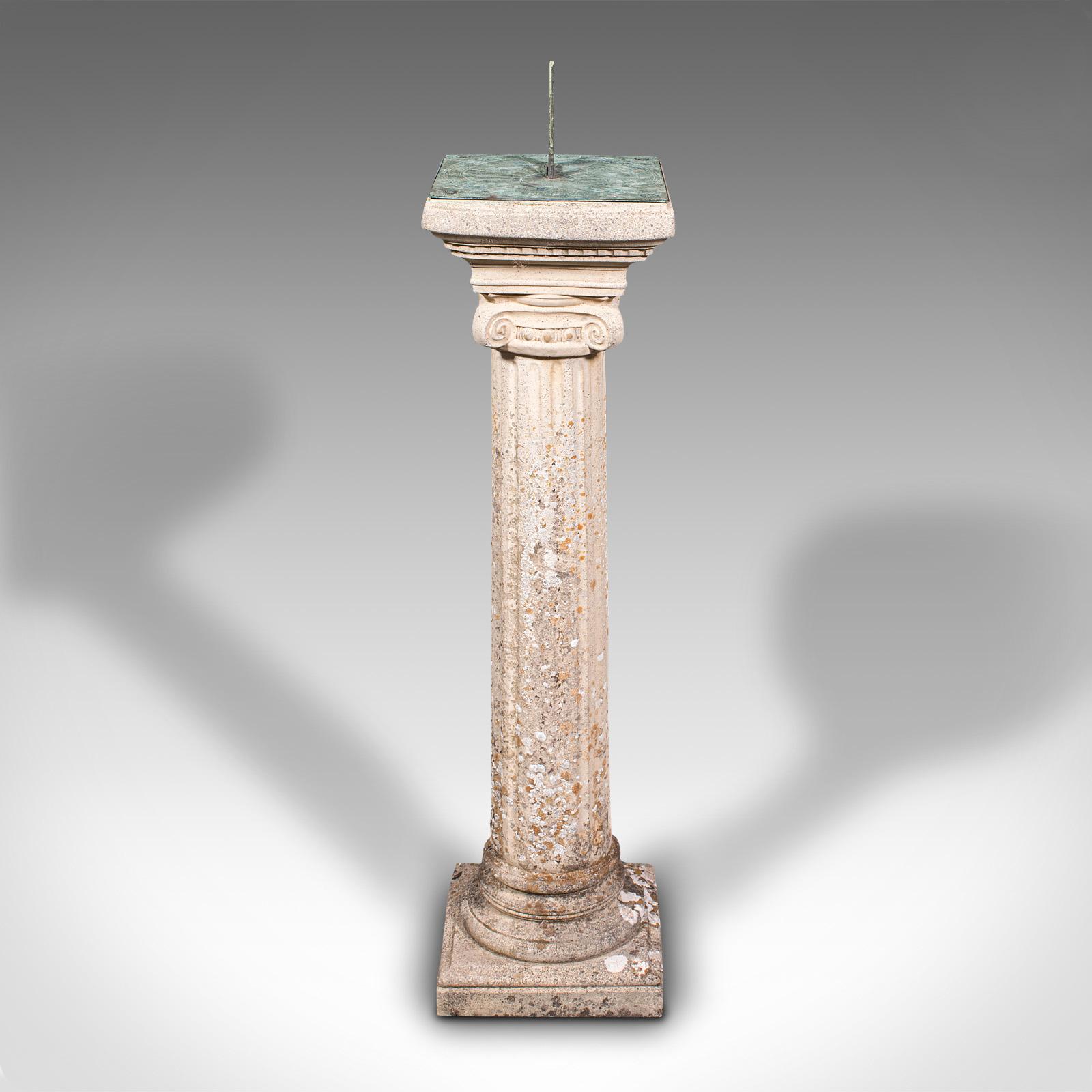 This is a vintage garden sundial. An English, reconstituted stone column with bronze dial and gnomon, dating to the mid 20th century, circa 1950.

Fascinating treat for your garden with lovely weathered appearance
Displays a desirable aged patina
