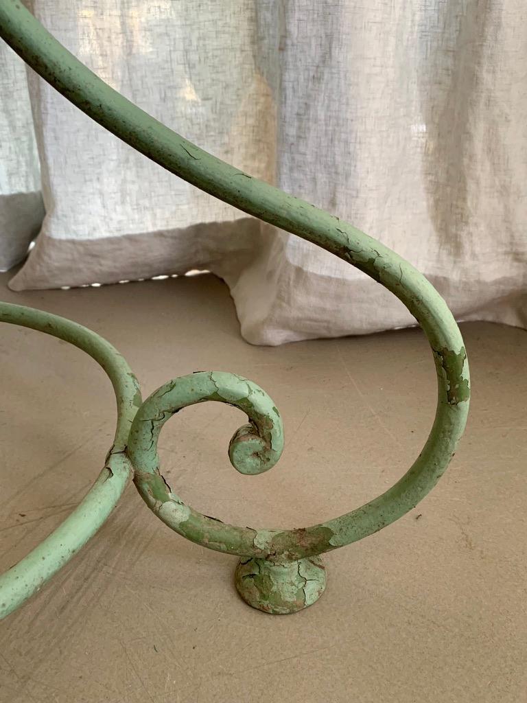 French vintage wrought iron garden table. The green painted table has great patina.