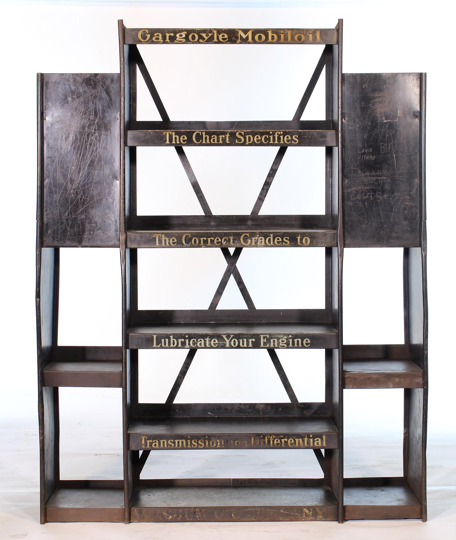 Authentic vintage automotive Mobil oil metal gargoyle display storage rack from the 1930s. Used to display oil cans at a garage or shop. An incredible piece of Automotive Americana Memorabilia. Would make an incredible dry bar or industrial style