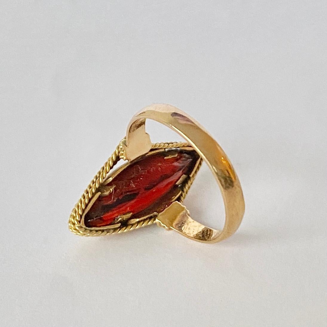 This stunning shaped garnet is a deep red colour. The stone is wrapped with twisted rope twist chain. 

Ring Size: L 1/2 or 6 
Widest Point: 22mm

Weight: 5.5g