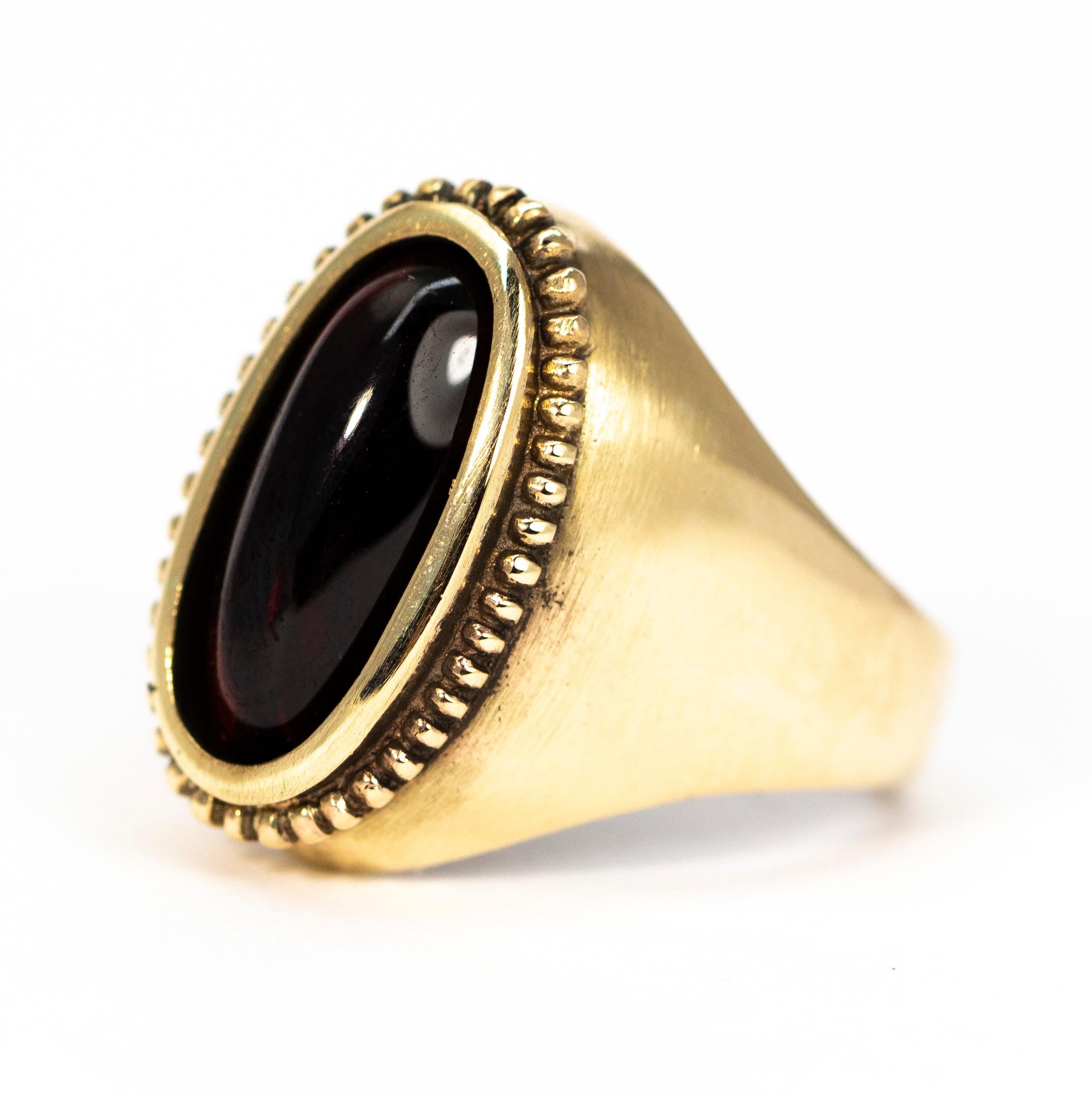 This glossy garnet stone is so smooth and beautiful and is sat in a dot detailed setting and is modelled in 9ct gold. 

Ring Size: M 1/2 or 6 1/2
Stone Dimensions: 14 x 6mm 

Weight:  7.5g