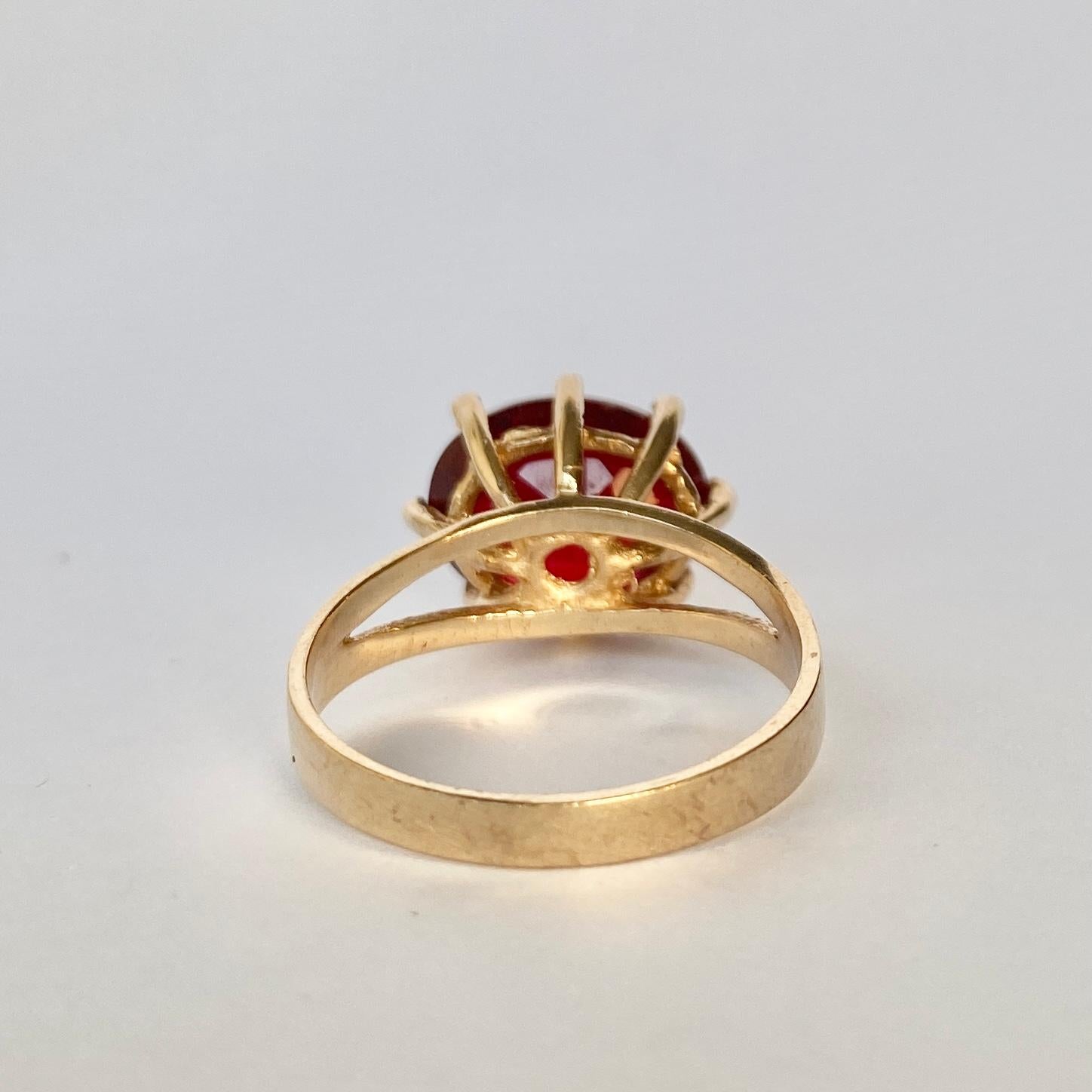 This deep red garnet stone has a rich red glow when the light hits it. The stone is set up high in open claws. Modelled in 9ct gold. 

Ring Size: P or 7 3/4 
Stone Dimensions: 10x12mm
Height Off Finger: 8mm

Weight: 3.8g