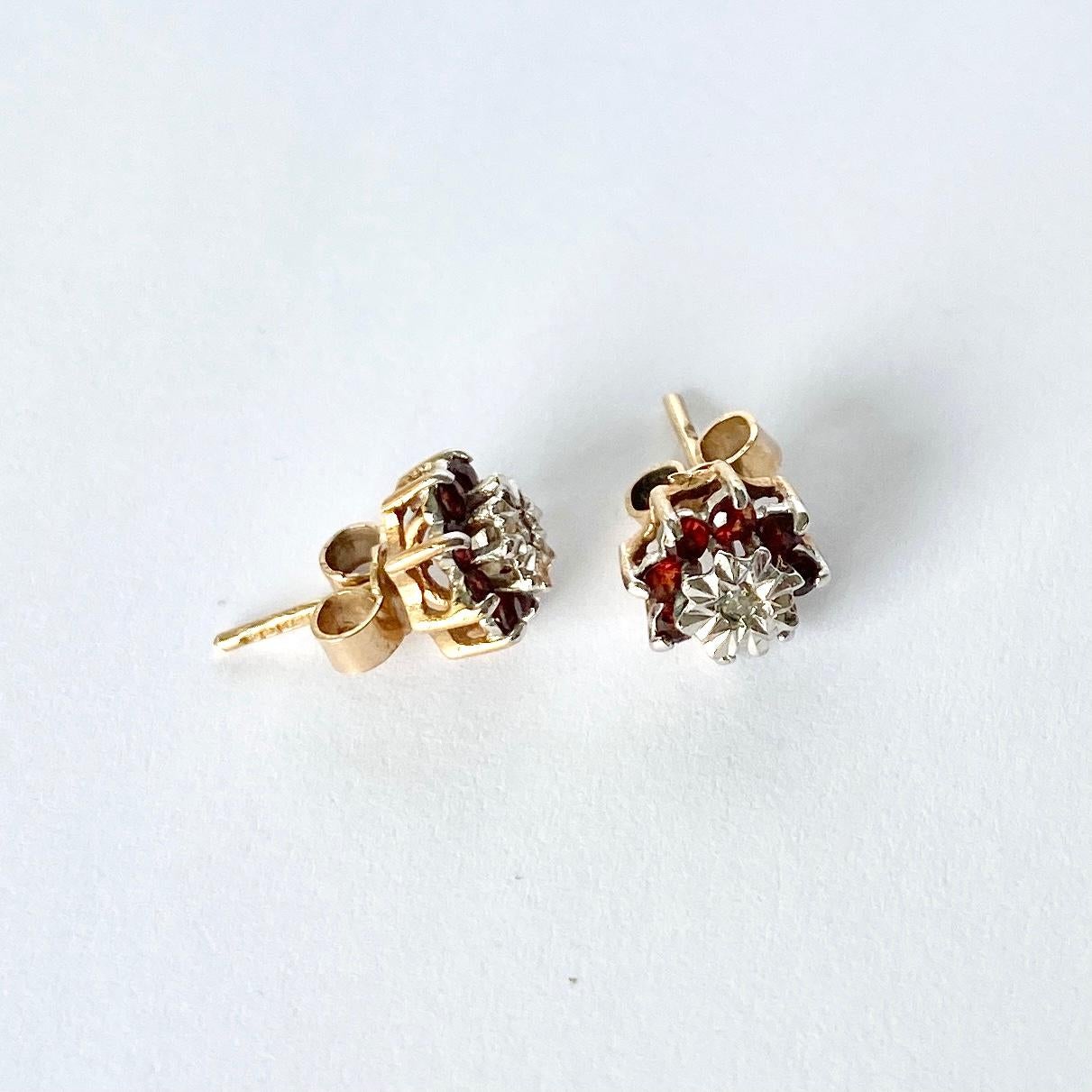 The garnets are a beautiful deep, rich red colour and have a diamond set in an illusion setting at the centre. The diamond measures approx 3pts per earring and the garnets total approx 25pts per earring.

Cluster Diameter: 8mm 

Weight: 1.6g
