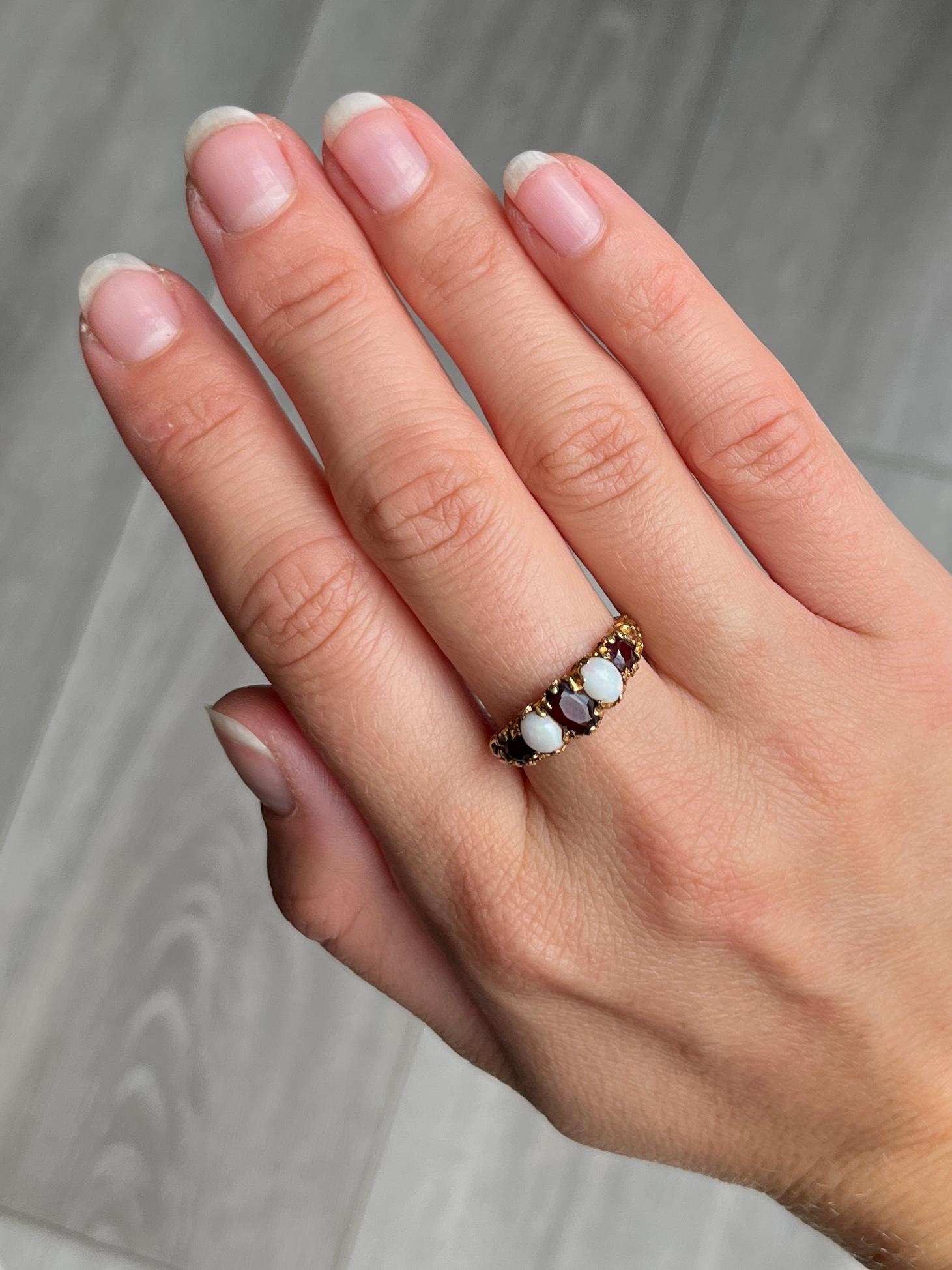 Modern Vintage Garnet and Opal 9 Carat Gold Five-Stone Ring For Sale
