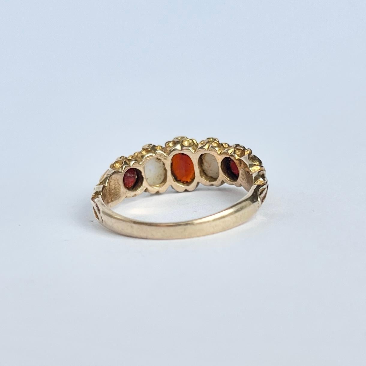 Oval Cut Vintage Garnet and Opal 9 Carat Gold Five-Stone Ring For Sale