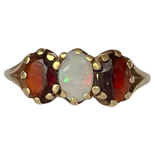 Vintage Garnet and Opal 9 Carat Gold Three-Stone Ring