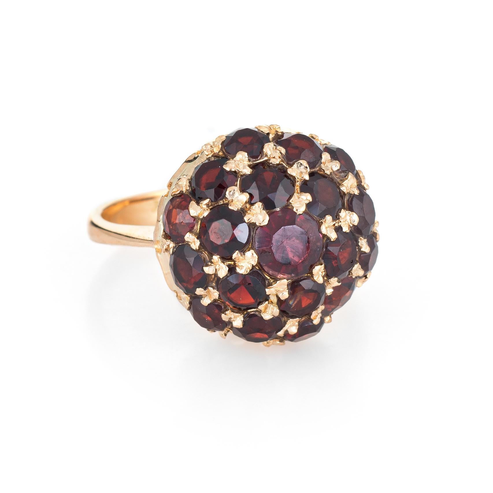 Finely detailed vintage garnet dome ring (circa 1960s to 1970s), crafted in 18 karat yellow gold. 

Garnets range in size from 0.10 to 0.20 carats and total an estimated 2 carats. The garnets are in excellent condition and free of cracks or chips.