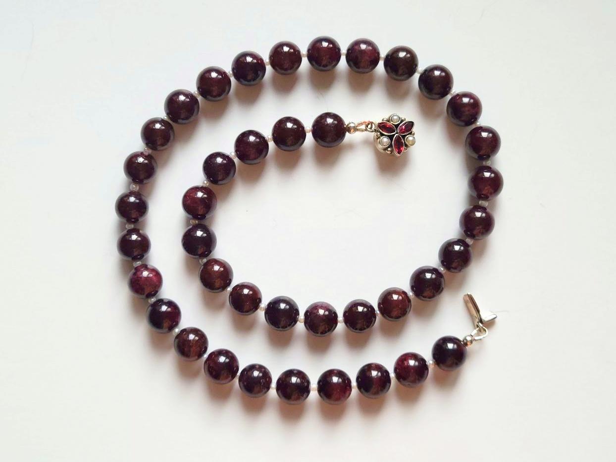 The length of the necklace is 18.5 inches (47 cm). The size of the smooth round beads is 10 mm.
The color of the beads is authentic and natural. No thermal or other mechanical treatments were used.
The necklace is fastened with a beautiful, rare