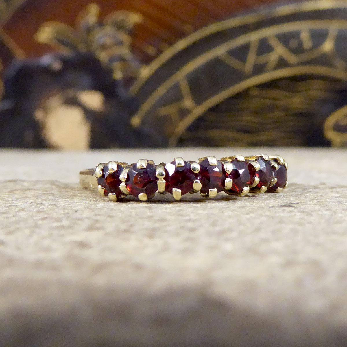 Such a lovely vintage ring featuring seven gorgeous garnets in claw settings. This ring has been crafted in 1997 with hallmarks on the inner band and modelled in 9ct Yellow Gold, such a beautiful vintage half eternity ring. 


Ring Size: UK P or US