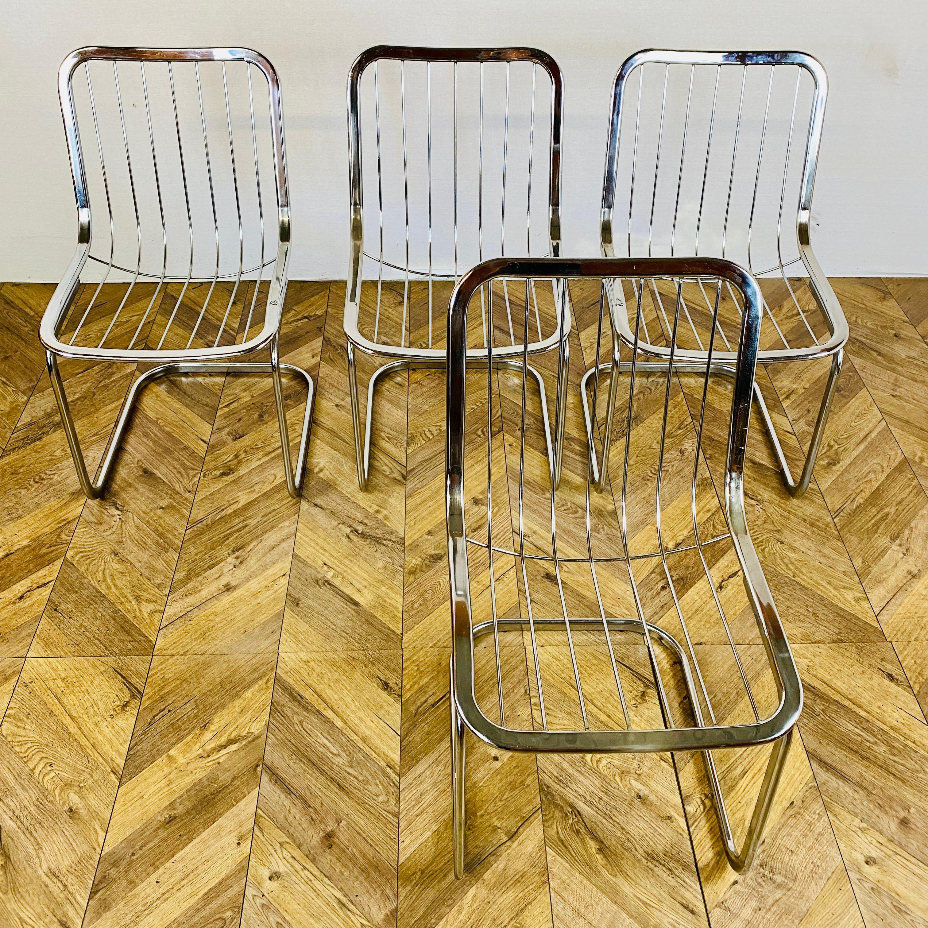 Set of 4, vintage mid century chrome dining chairs designed by Gastone Rinaldi, circa 1970s. Made in Italy.

The chairs are made from chrome with original velour seats.

The chairs are in great condition, but in-keeping with their age and usage