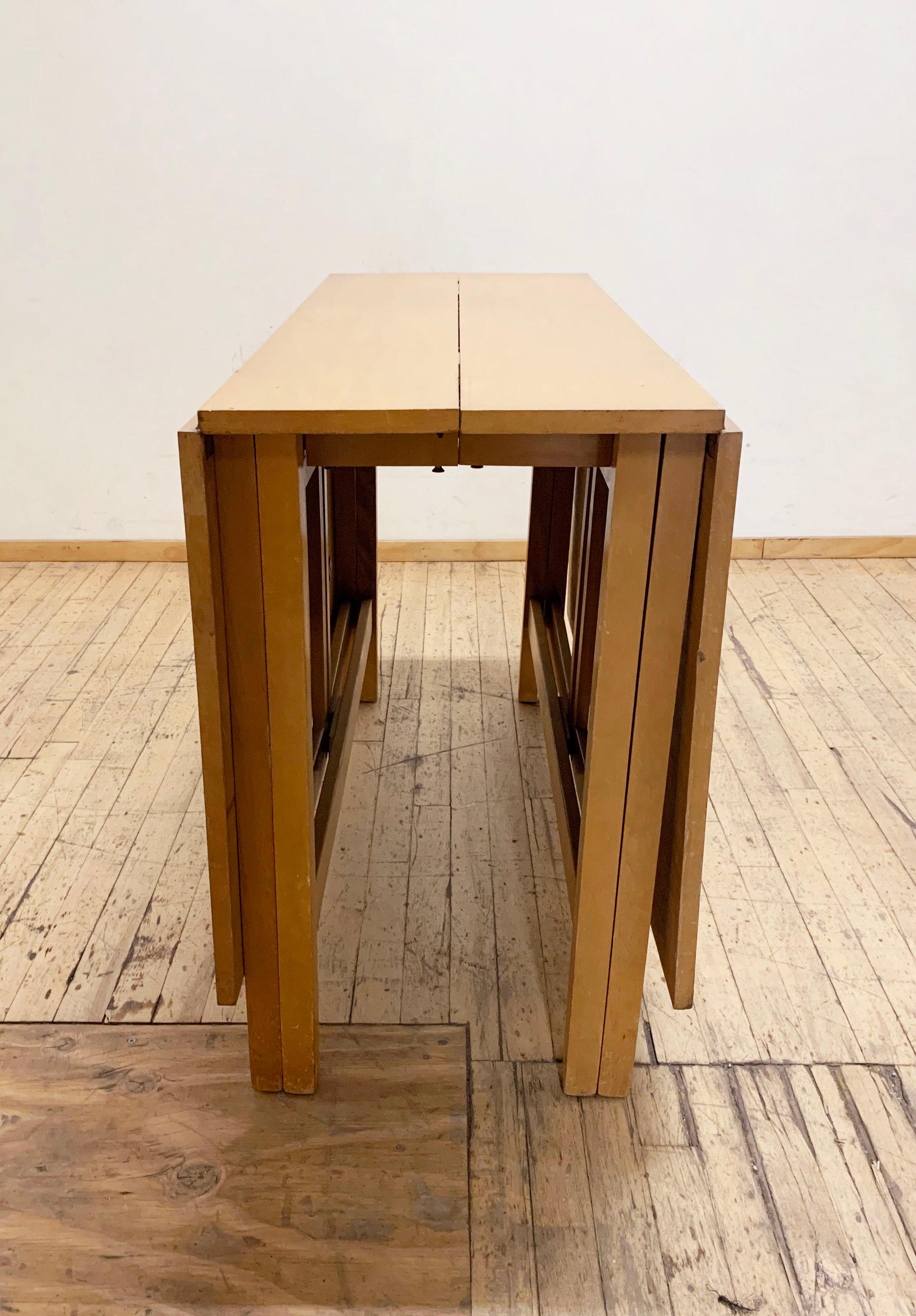 Vintage Gate Leg Dining Table attributed to Bruno Mathsson.
I fine early design example of this gate-leg design. One notable difference from the Mathsson design is the simplicity of the legs. There are no rounds. 
also note the fine detailing border