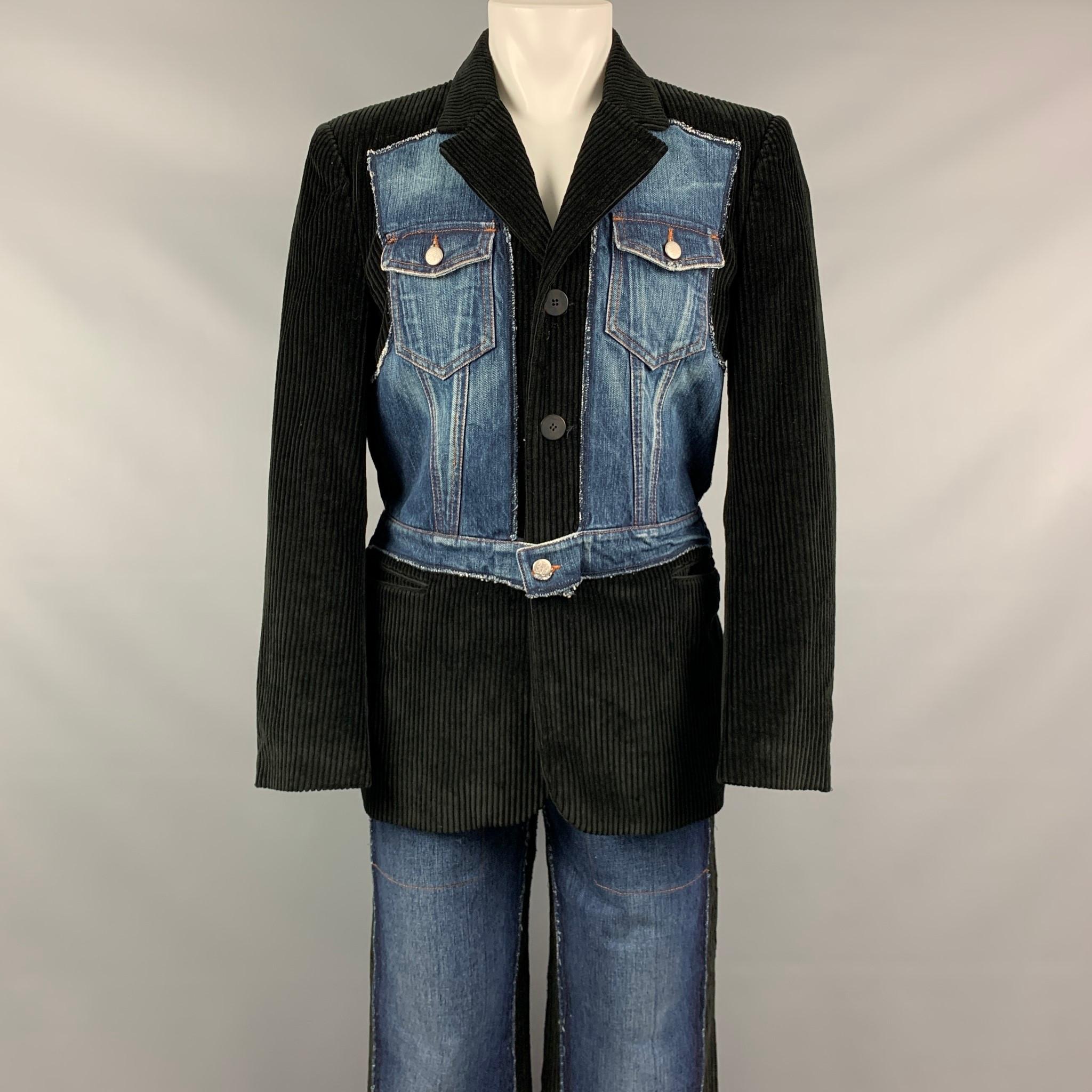 Vintage GAULTIER JEANS suit comes in black corduroy with a denim overlay and includes a single breasted, three button sport coat with notch lapel and matching straight leg pants.

Very Good Pre-Owned Condition.
Marked: I 50 / USA 34 / F 42 / GB 40 /