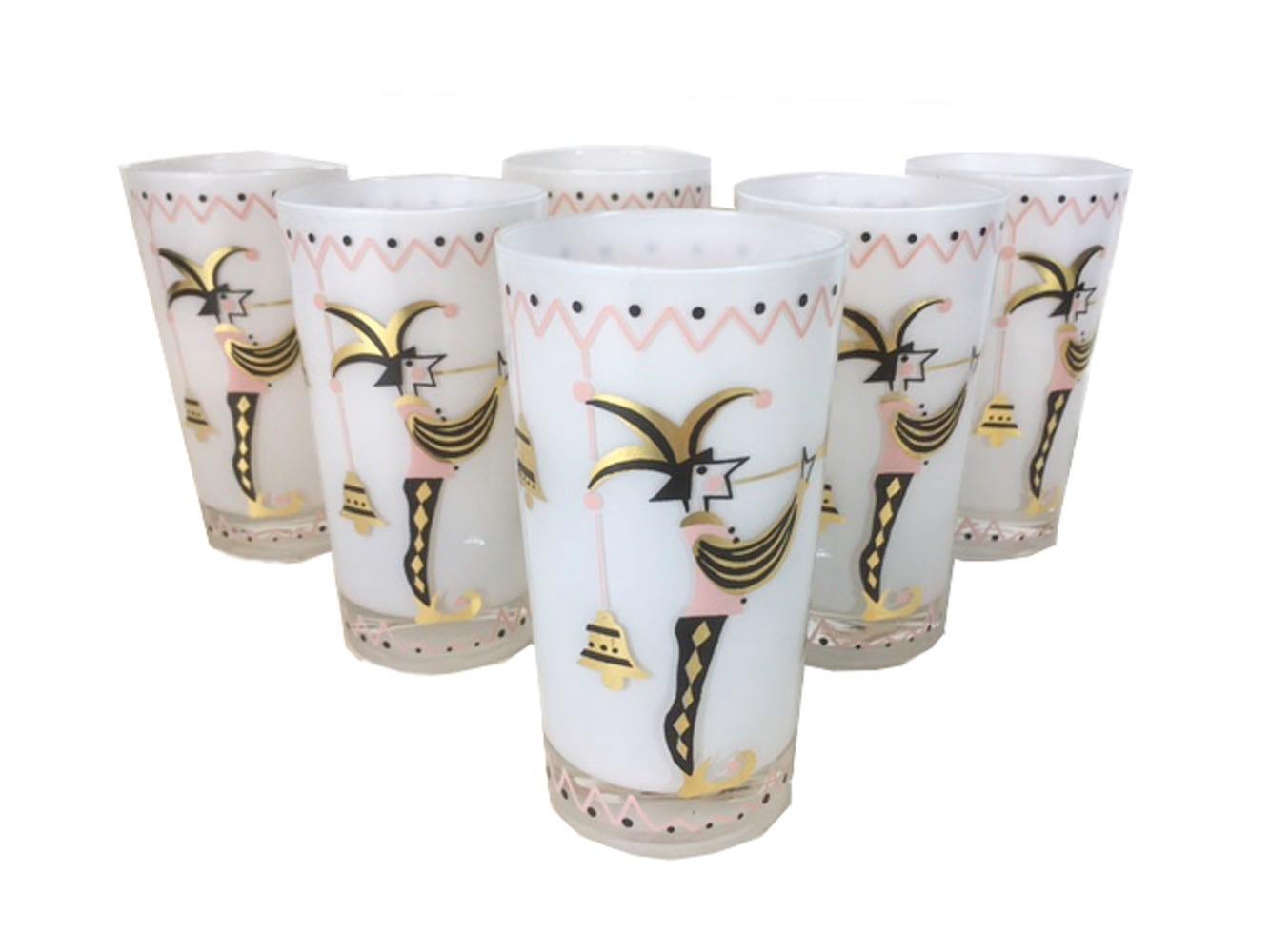 Vintage set of 6 cocktail glasses by Gay Fad. Clear glass with white interior frosted surface, decorated with a jester blowing a trumpet on the exterior in black, pink and gold. All in excellent condition.