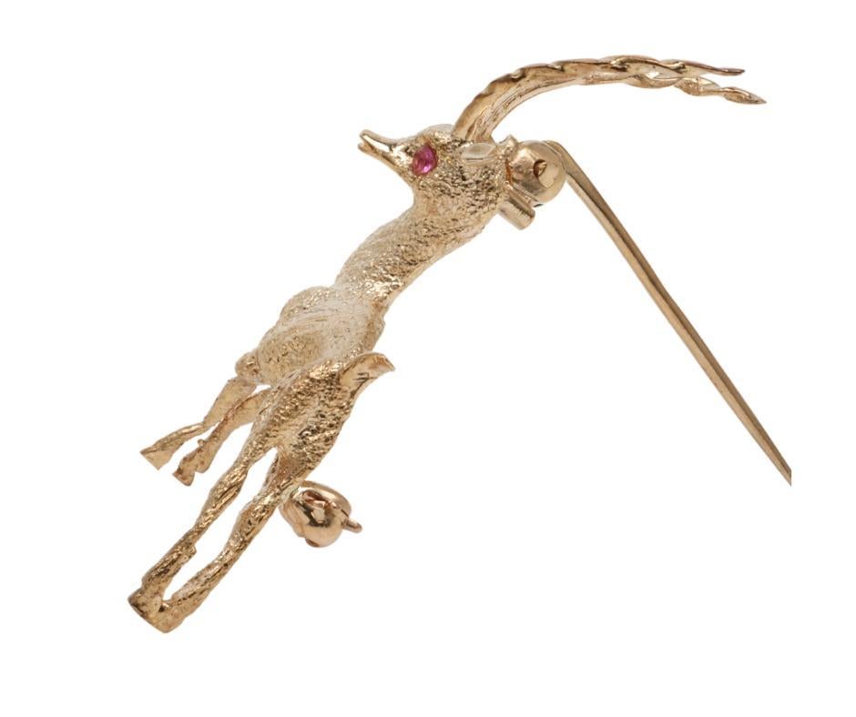 Vintage Gazelle Pin 14k yellow Gold With Ruby Eyes 
   

     Pin 
       Metal - 14k Yellow Gold 
       Weight - 4.9 Grams 
       Dimensions - 1.75in x 1.0in 

   Stones 
       Ruby - 0.04 ctw 
       Color - Red