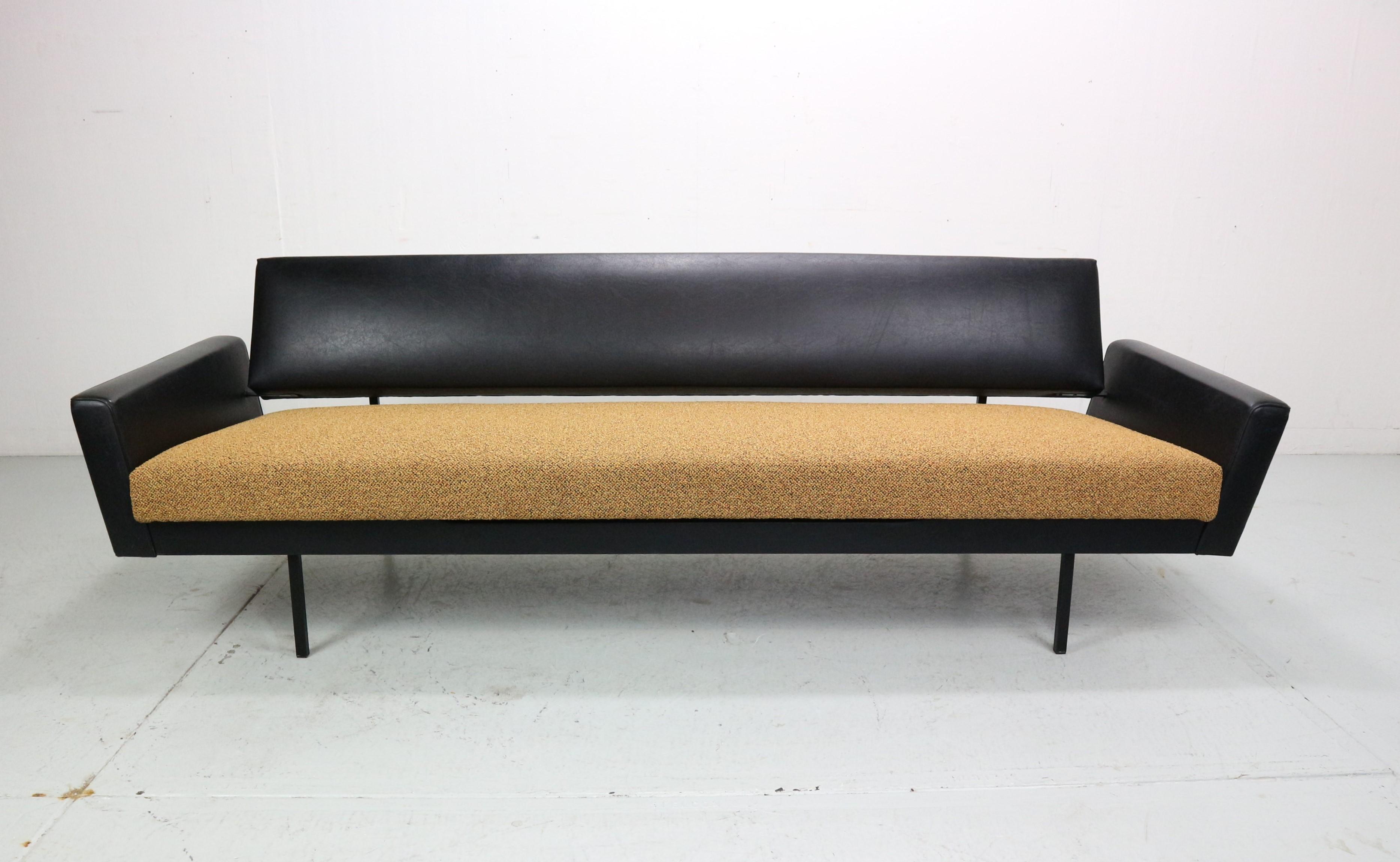 This sofa is designed by Rob Parry and produced by Gelderland. This specific design with upholstered armrests is quite rare. The seating part of the sofa can easily be pulled into a flat position that makes it comfortable to rest on for a little nap