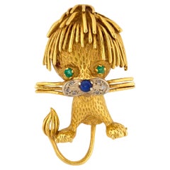 Vintage gemstone 18k gold lion brooch