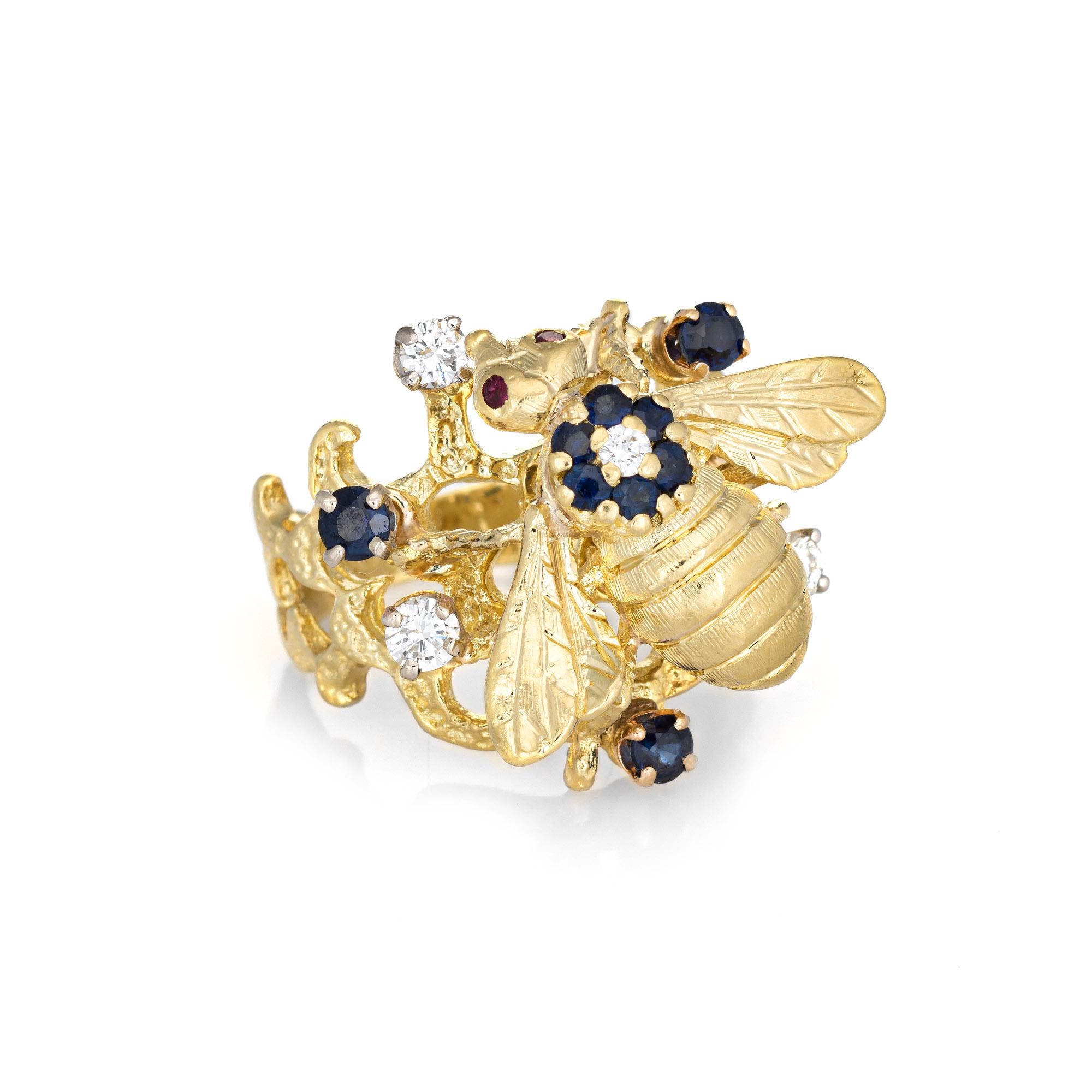 Stylish vintage diamond & sapphire bee ring (circa 1970s to 1980s) crafted in 18 karat yellow gold. 

Four diamonds are estimated at 0.05 carats each and total an estimated 0.20 carats (estimated at G-H color and VS2-SI1 clarity). The sapphires