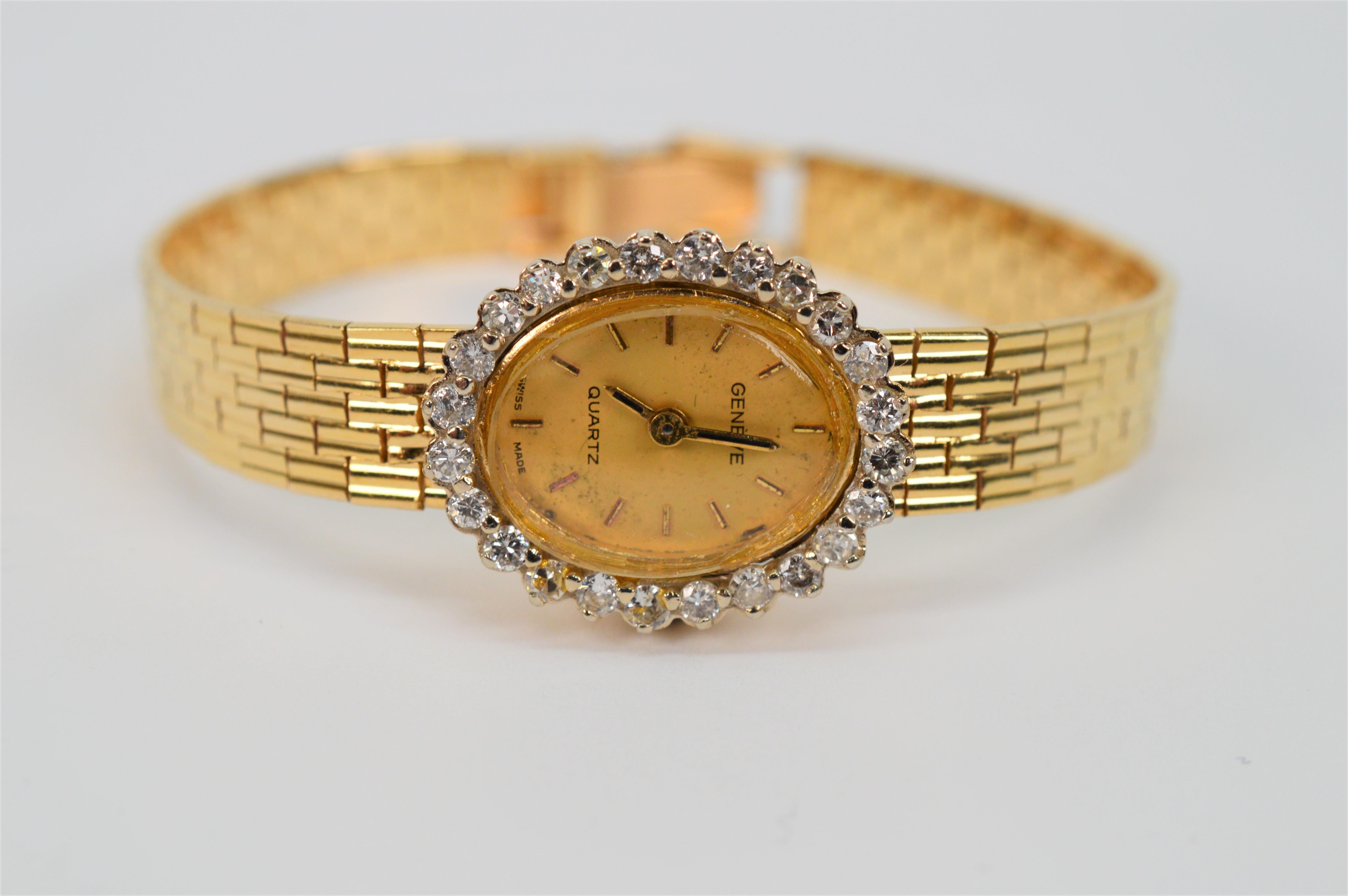 Circa 1960 Geneve with rich fourteen karat 14K yellow gold bracelet the fine ladies dress watch has a beautifully diamond framed oval face with .72 carat of H/I2 diamonds.  The watch has a quartz movement and fresh battery (number 364). The
