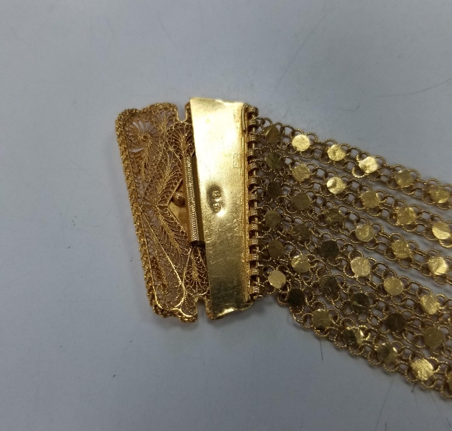 Montre-bracelet vintage Geneve en or jaune 14 carats tissé et corde avec pompons 1