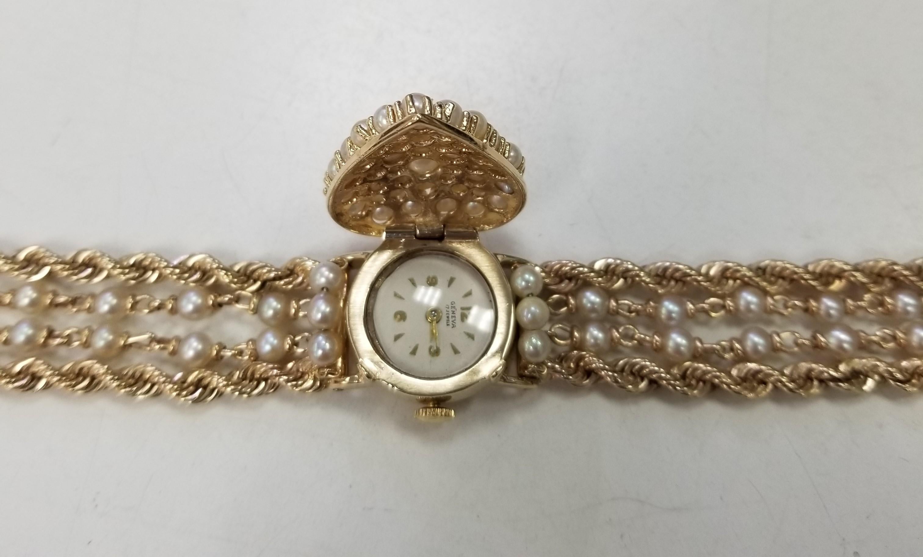 Vintage Geneve 14 Karat Gelb Perle & Gold Seil Armbanduhr mit versteckten Uhr.  Die Uhr ist ein Geneve-Handwerk mit 17 Steinen und einer Sicherheitsschließe.  Die Uhr hat ein gewartetes Uhrwerk.  Die Breite beträgt 26 mm und wiegt 73 Gramm. Die