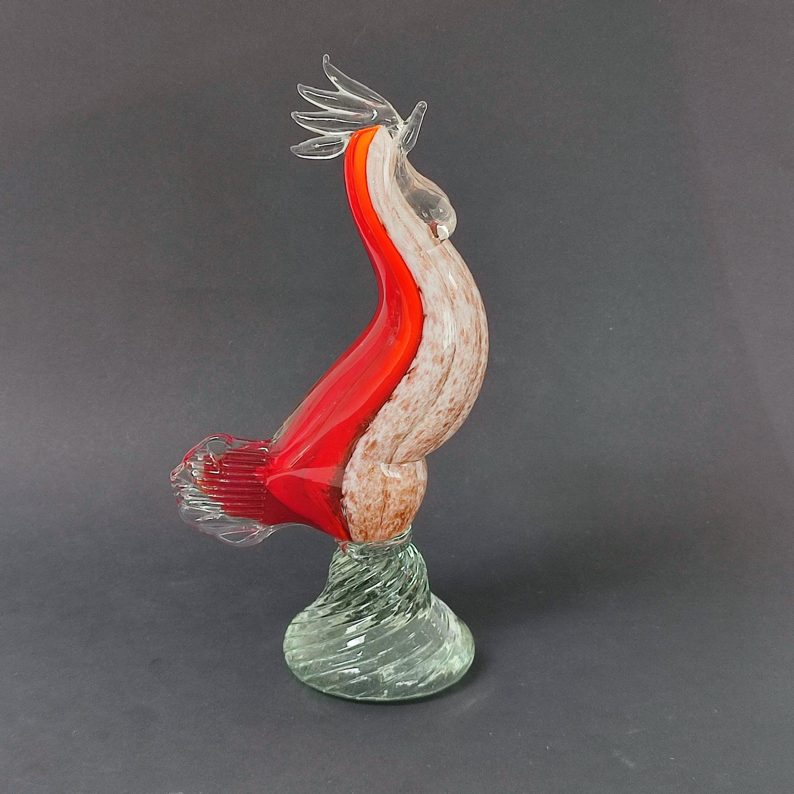 Beautiful vintage Murano glass chicken intricately made in several glass techniques. Breast made of aventurine speckled glass encased in lattimo, ribbed shape, heat applied dark red backside and clear crest and tail. All mounted on a swirled
