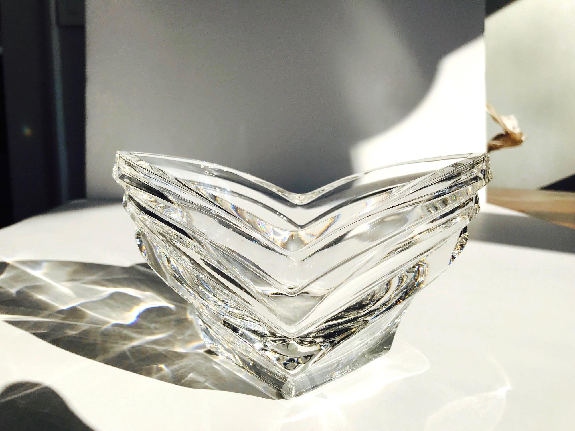 Mid-Century Modern crystal dish with geometric fluted glass. The hand blown dish features horizontal fluting in perfect symmetry resembling a wave formation or perhaps a budding flower. Reflects light like a prism, and is beautiful from every angle.