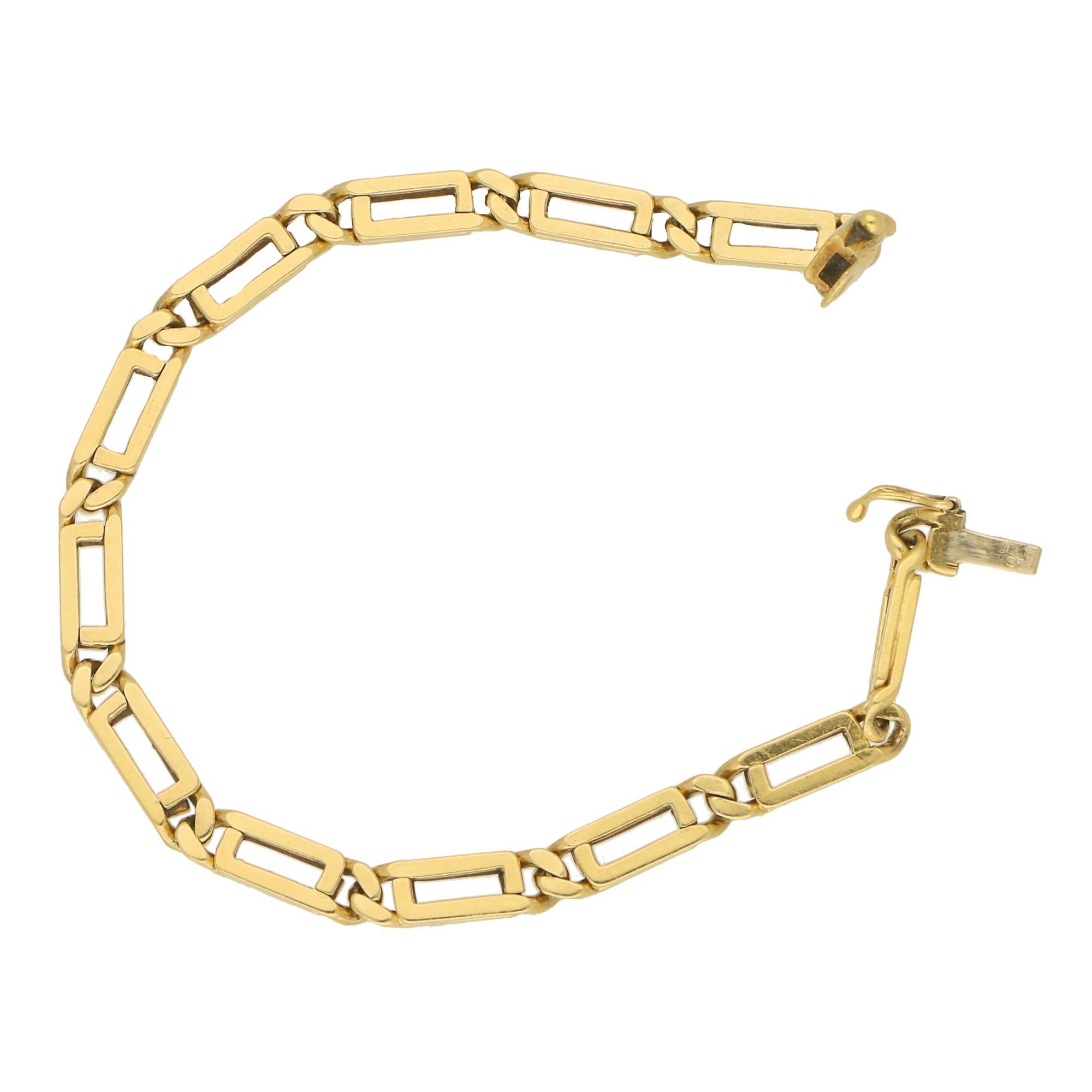 A elegant 1970's geometric openwork link bracelet set in 18k yellow gold.
 
The bracelet is composed of a repeating sequence of articulated openwork rectangular links, fitted with a click-shut clasp and a safety catch fitting. 

The piece is 18cm in