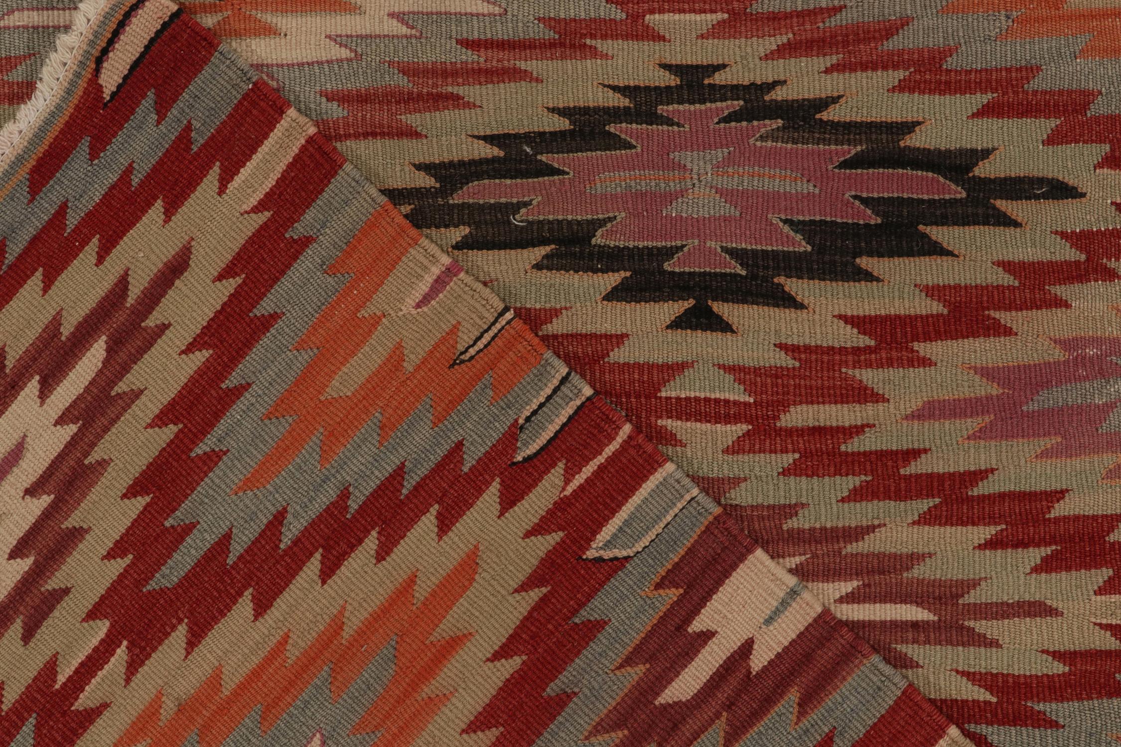 Mid-20th Century Vintage Tribal Kilim rug in Red, Orange and Blue Geometric patterns For Sale