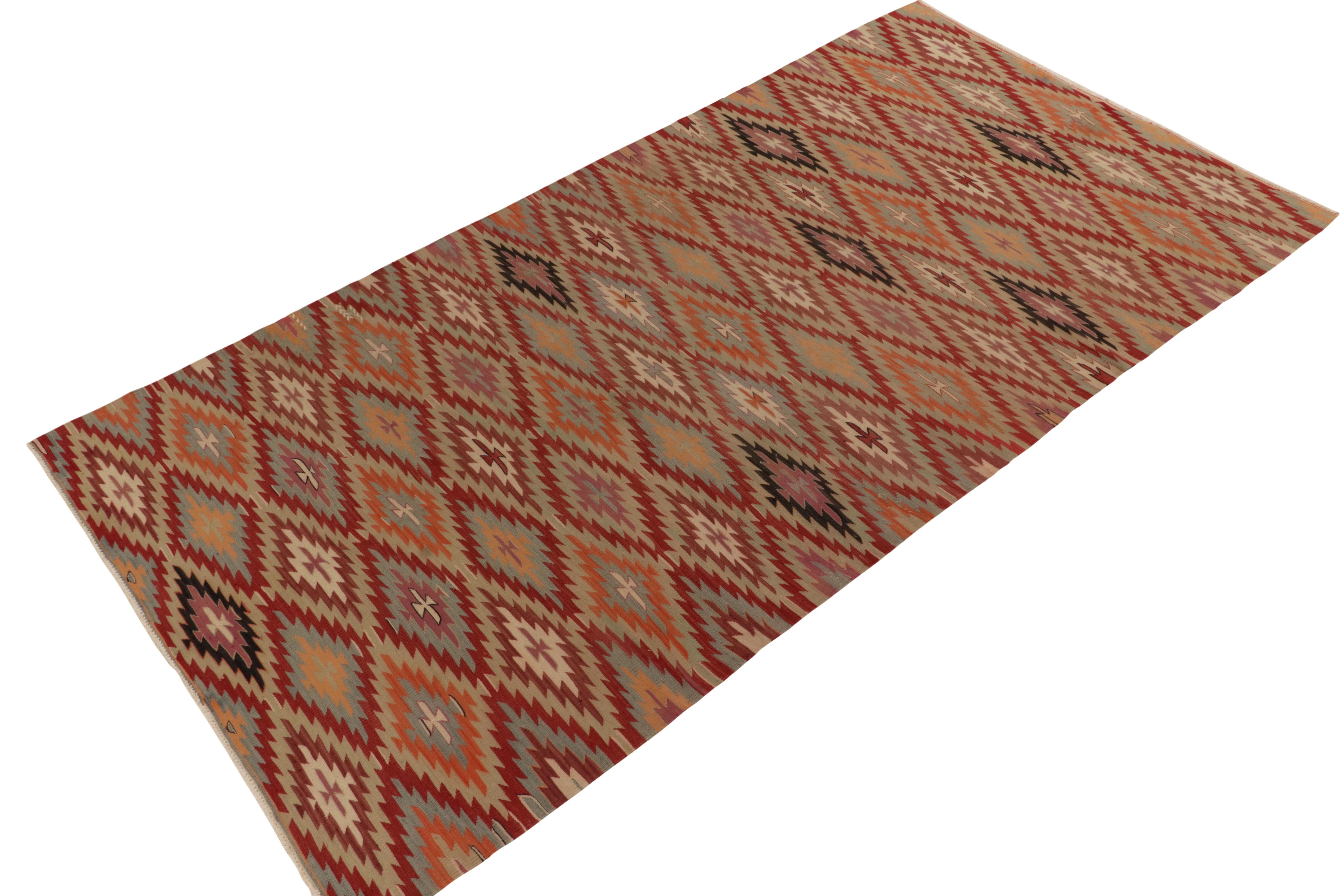 Handwoven in wool from Turkey circa 1950-1960, a vintage kilim among R&K Principal Josh Nazmiyal’s curated tribal flat weaves. 

On the Provenance: The rug revels in the rustic charm of tribal repetition in classic reds, oranges, blues and other