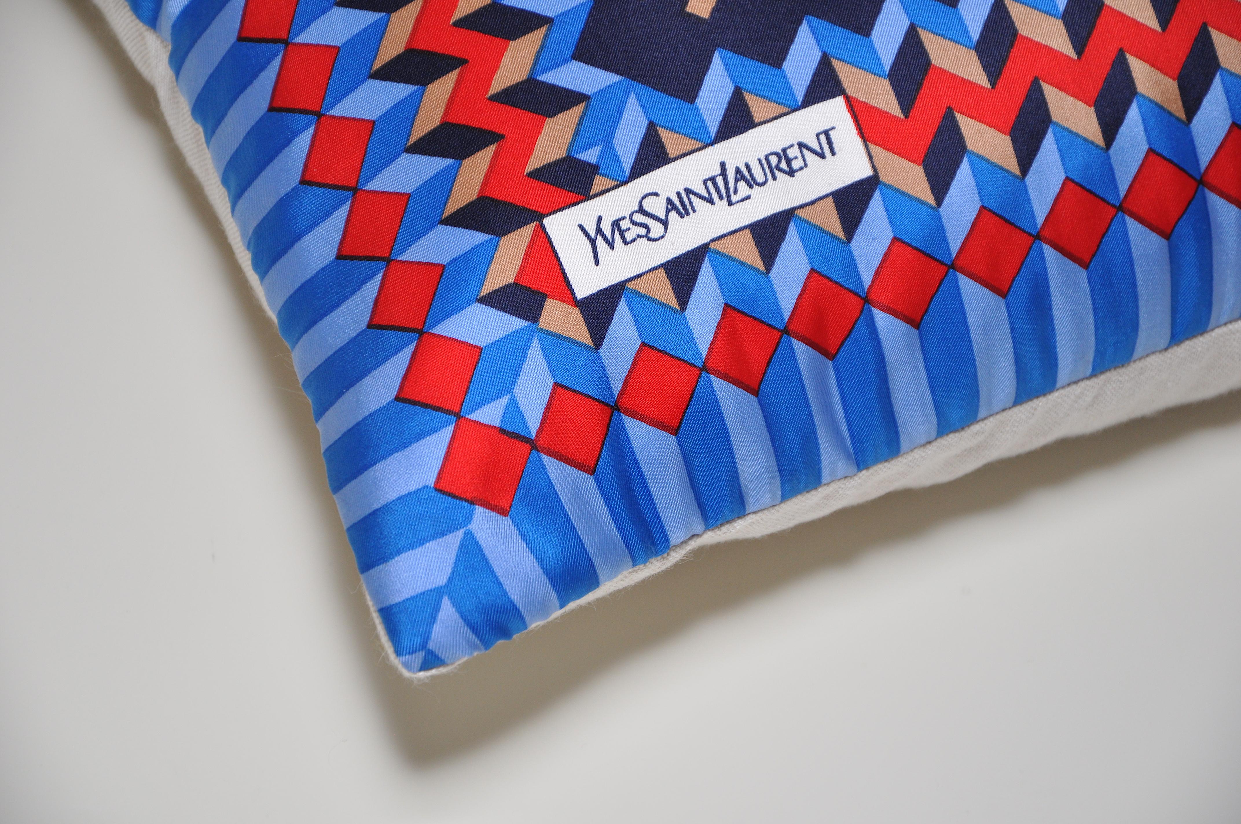 Vintage geometric red blue YSL fabric cushion with Irish linen pillow

This cushion is a one-of-a-kind and part of a sustainability project. 
It has been created from an up-cycled, recycled luxury fabric, used with the intentions of promoting a