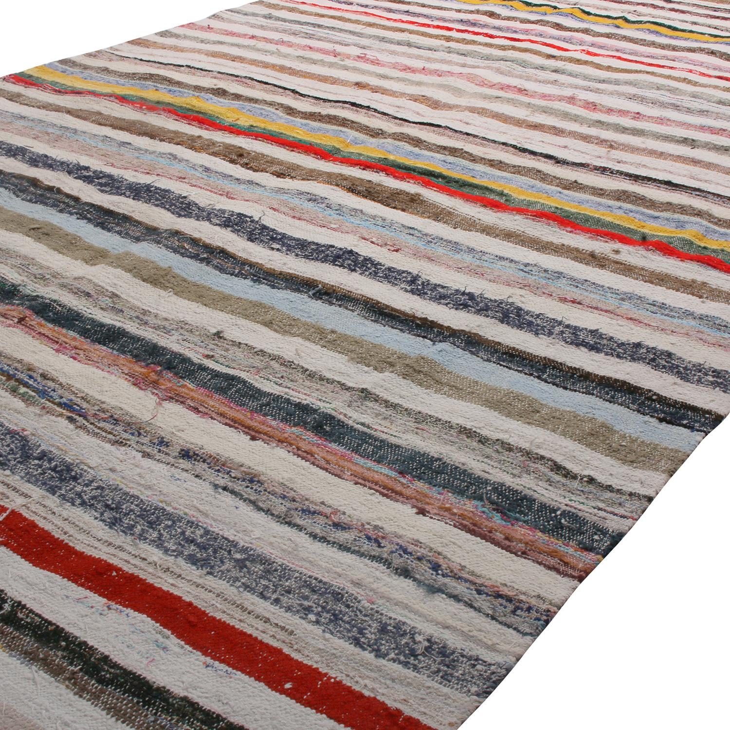 Handwoven in Turkey originating between 1970-1980, this vintage wool kilim rug enjoys a play of subtle, intricate colorway variation and shabby-chic, classic texture complementing the striped pattern. The lively juxtaposition of rich beige brown
