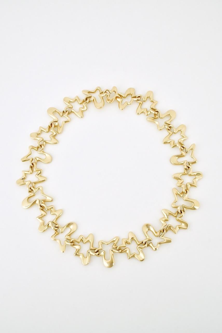 A rare modernist gold collar comprised of 22 links of an open abstract motif in 18k yellow gold known as the 