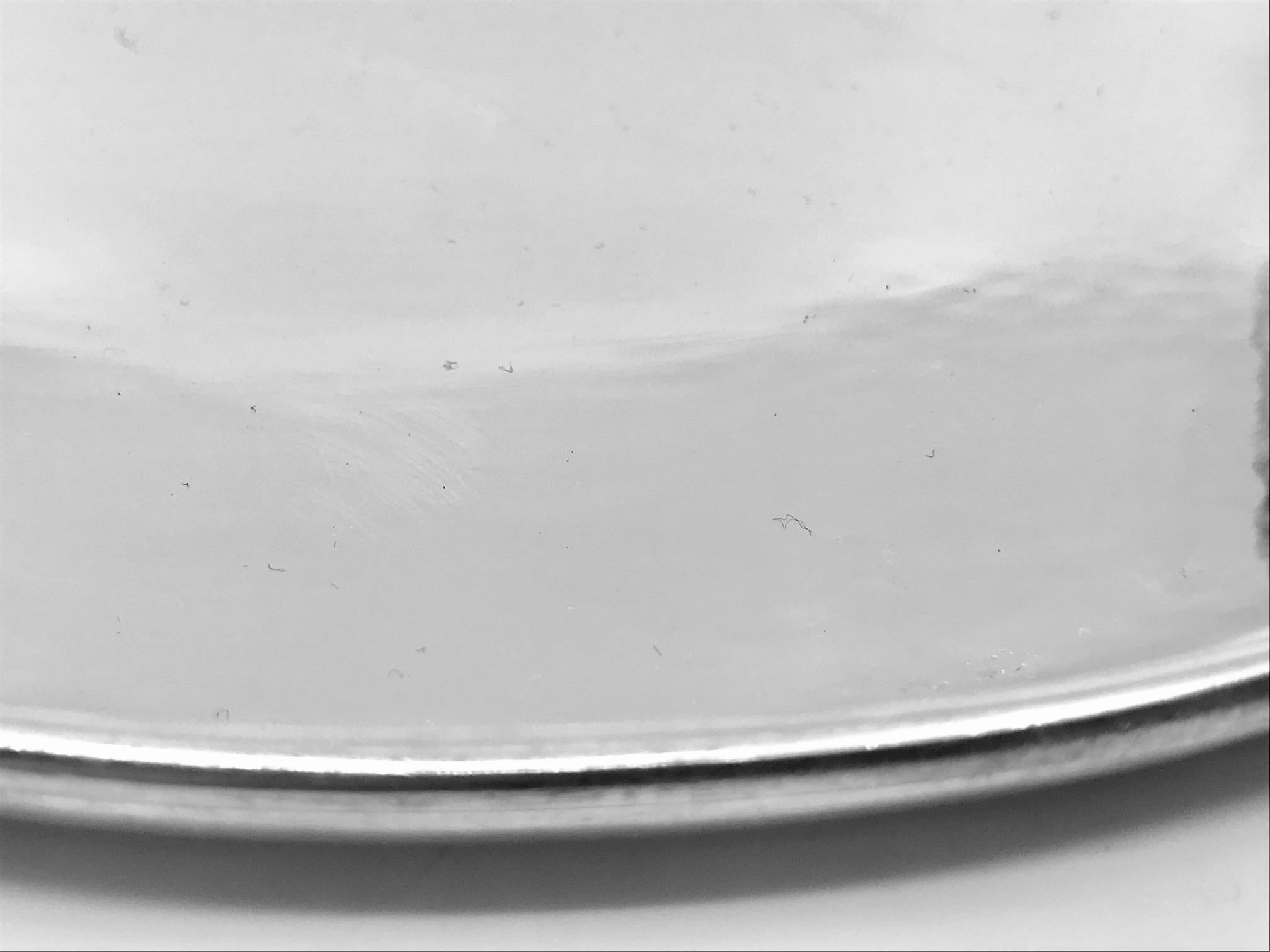 Vintage sterling silver Georg Jensen circular Blossom tray, design #2AB by Georg Jensen. The Blossom pattern goes back to 1905, when Georg Jensen designed the Blossom teapot, many other Blossom pieces followed.

Measures 13 3/4? across the