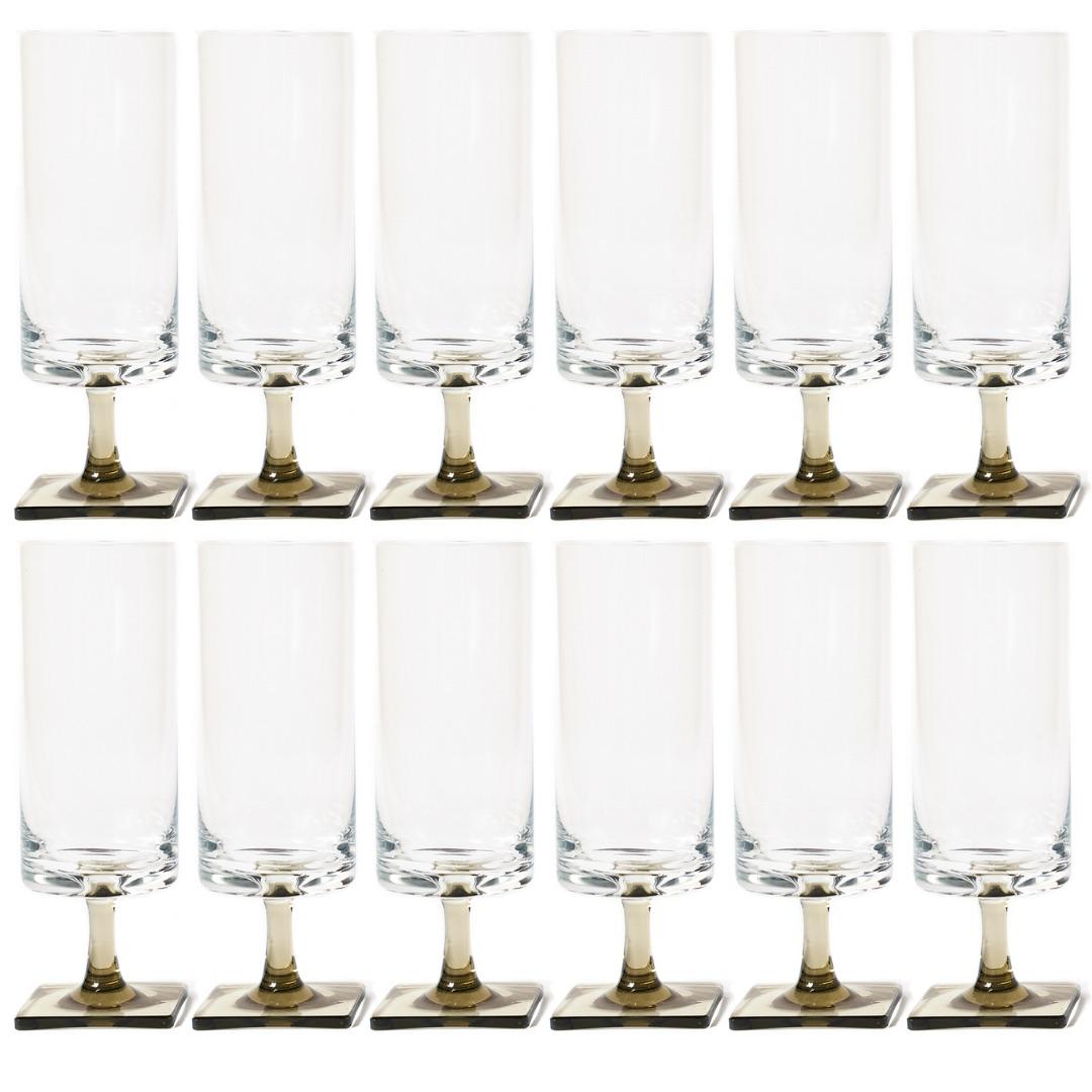 Vintage George Jensen for Rosenthal crystal Berlin/linear smoke pattern Champagne Flute glass set 12

Each glass has a crystal clear bowl with smoke gray stem and square base. Set includes champagne flutes and 
sherbet/champagne glasses. Each