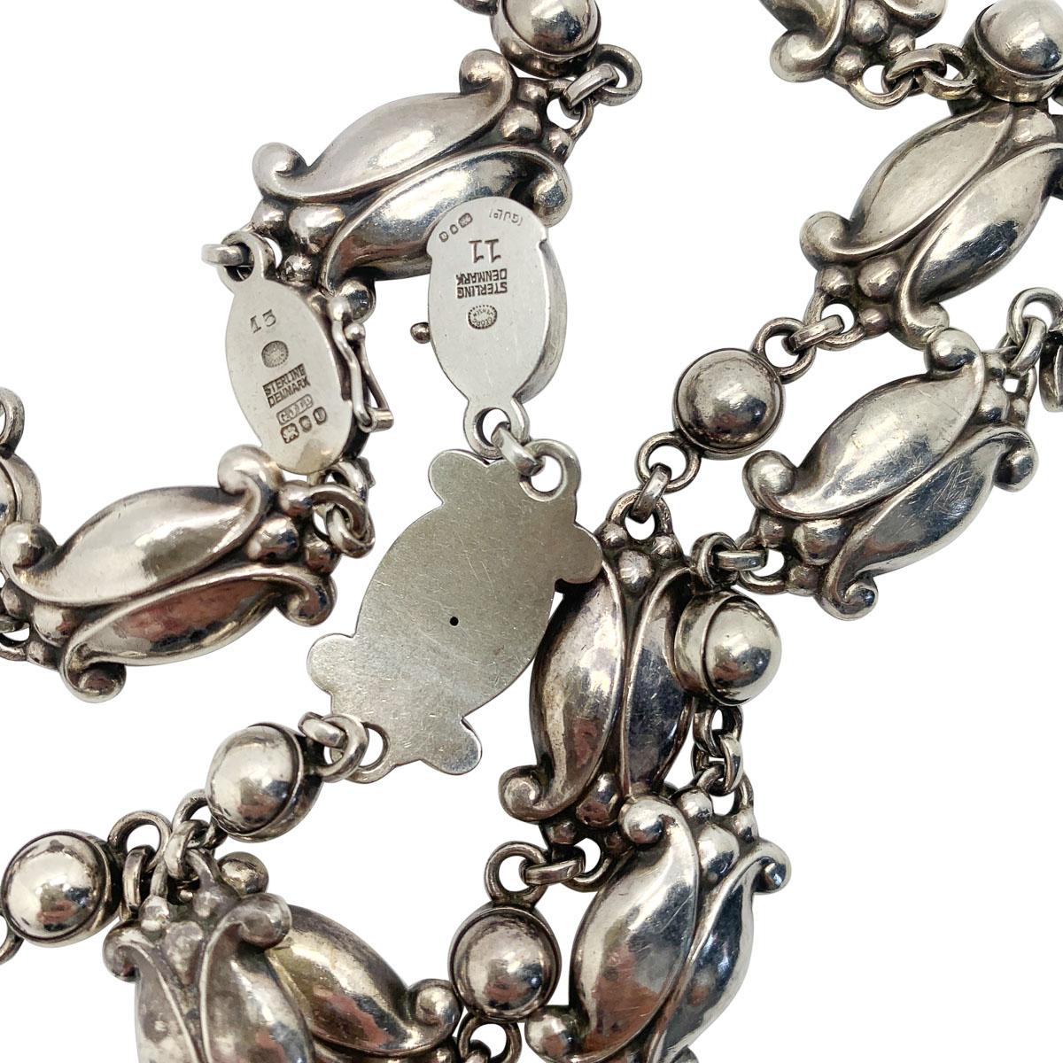 An eternally graceful 1950s sterling silver vintage Georg Jensen necklace and bracelet in the hugely coveted Moonlight Blossom design. 
Danish silversmith, Georg Jensen originally produced this design in 1905 inspired by elements of nature. This