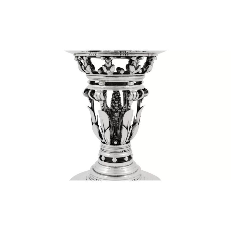 This is a large sterling silver Georg Jensen compote, design #252 by Johan Rohde from circa 1918 and known as the “Princess” bowl.
Classic Johan Rohde design with openwork stem decorated with leaves, berries and scrolls.

Additional