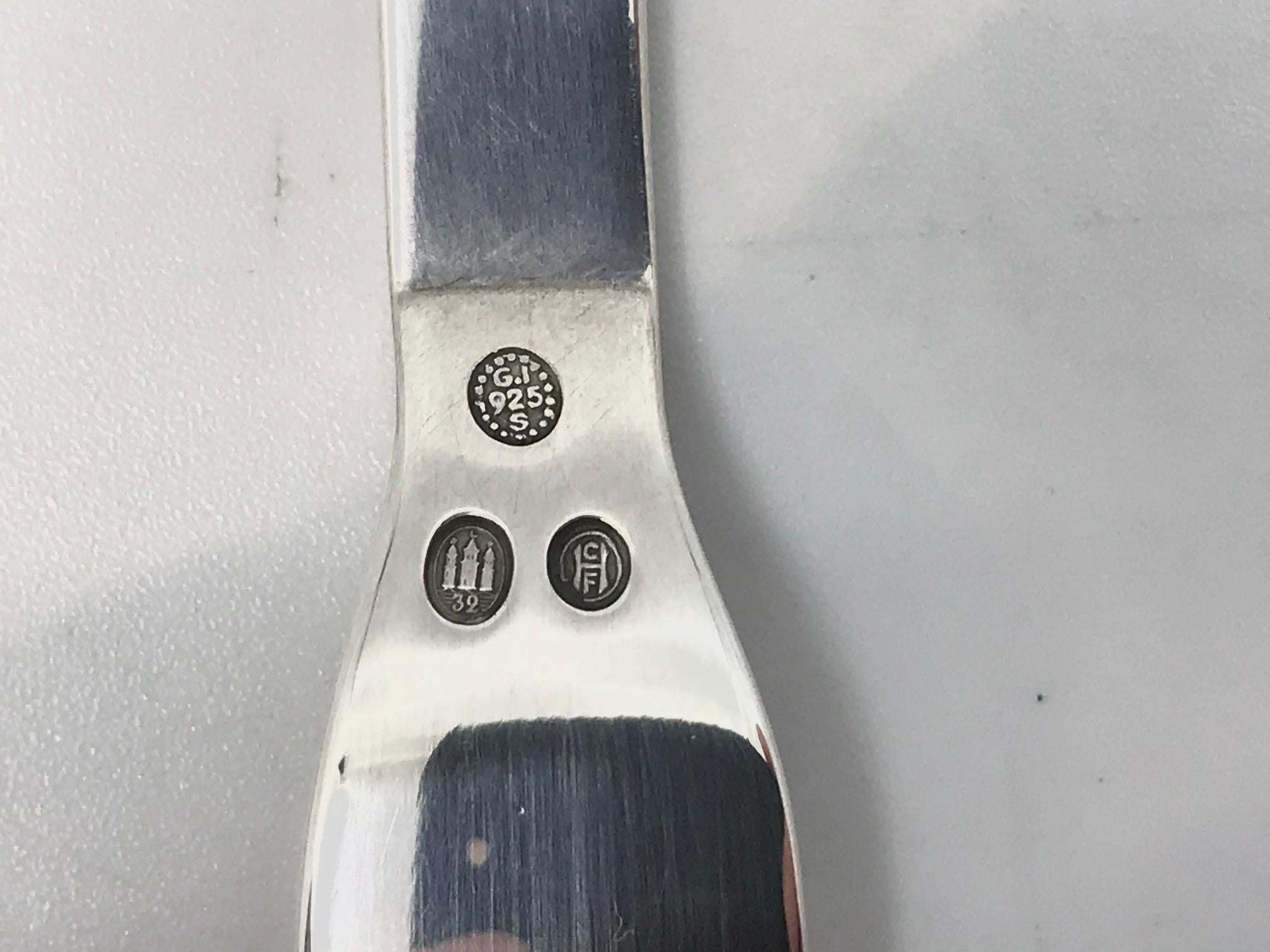 Sterling silver Georg Jensen cold cuts fork, item 144 in the Pyramid pattern, design #15 by Harald Nielsen from 1926.

Additional information:
Material: Sterling silver
Style: Art Deco
Hallmarks: With post 1944 Georg Jensen hallmark, made in
