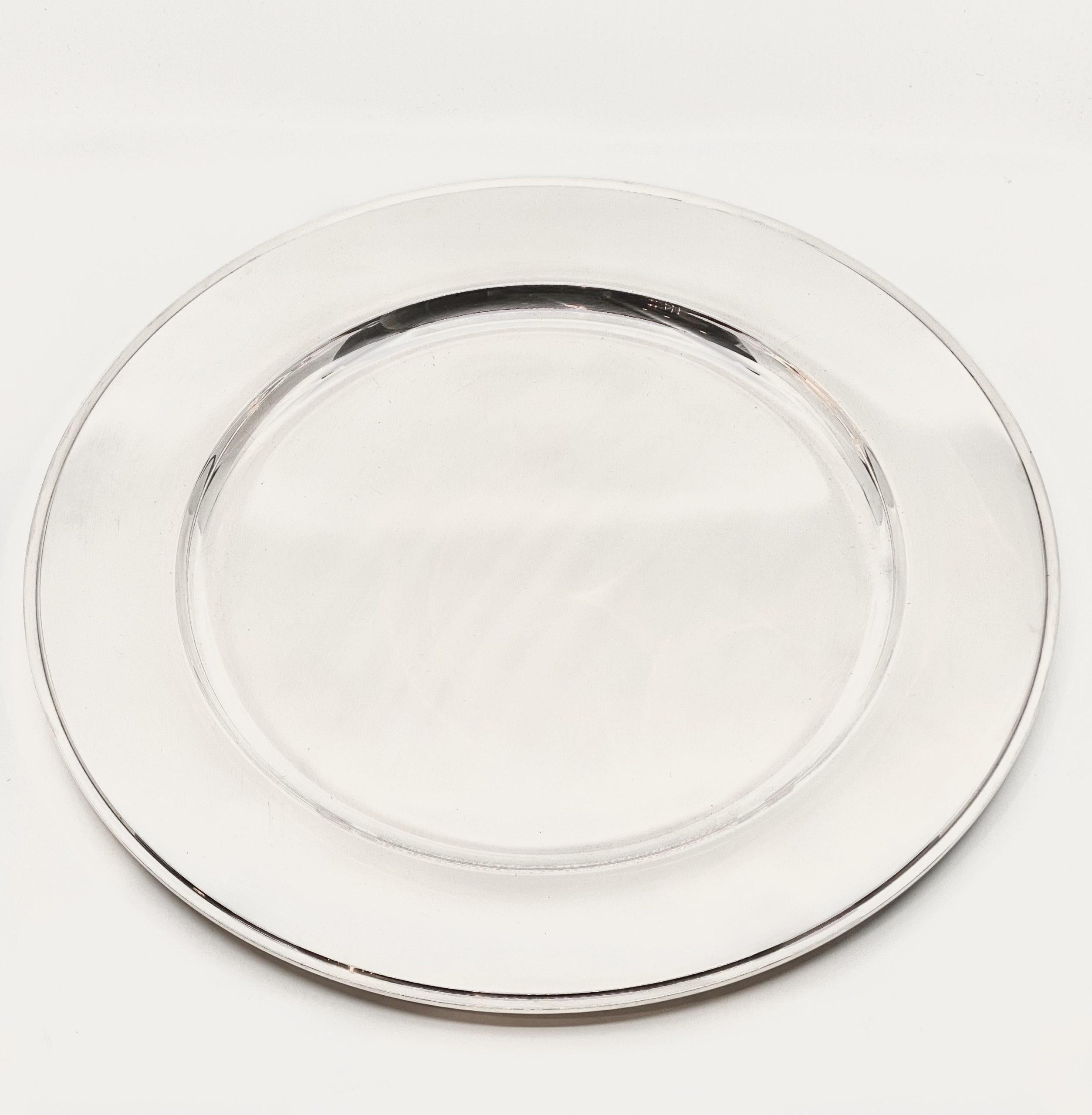 This is a sterling silver Georg Jensen serving platter in the Pyramid pattern, design #600M by Harald Nielsen from 1930.

Additional information:
Material: Sterling silver
Styles: Art Deco
Hallmarks: Georg Jensen hallmarks from