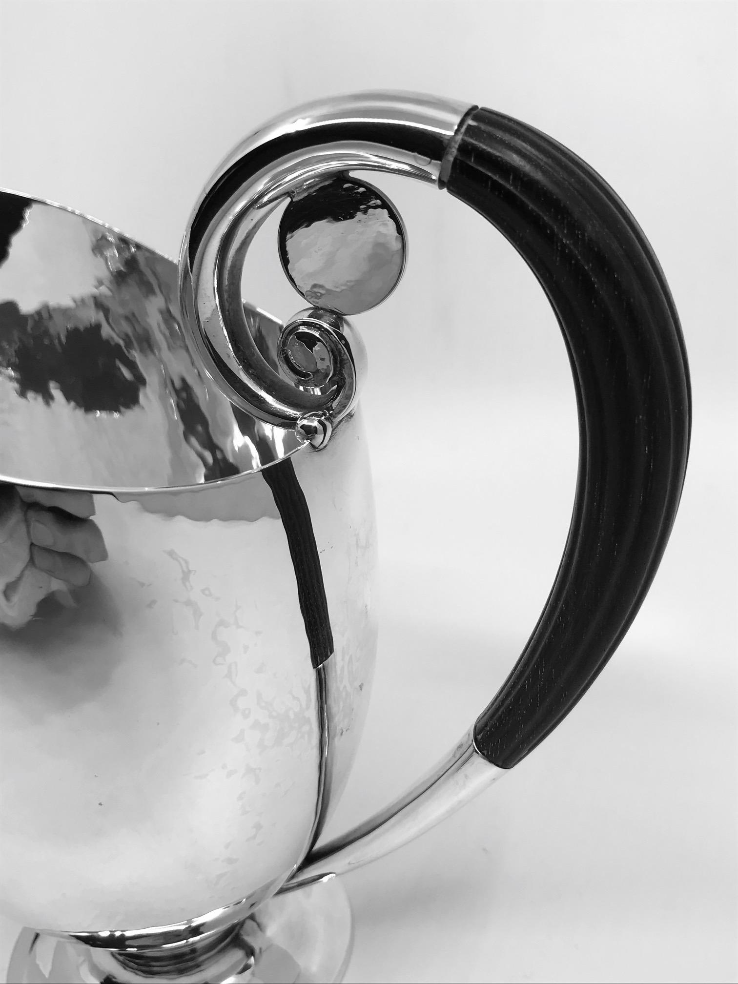 Sterling silver Georg Jensen pitcher with ebony handle, design #321A by Johan Rohde from 1919. Matches tea/coffee set #321. This design often referred to as 