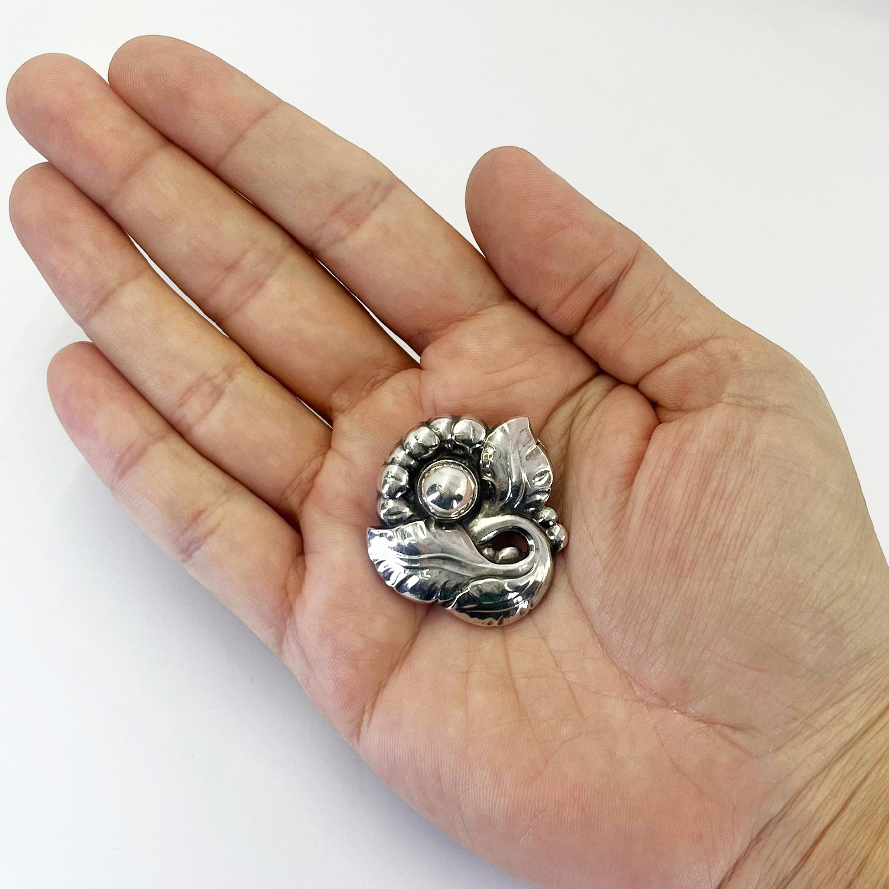 Georg Jensen Sterling Silver Brooch with Floral Design. Style 71. Made in Denmark. 1.5 inches long by 1.3 inches.