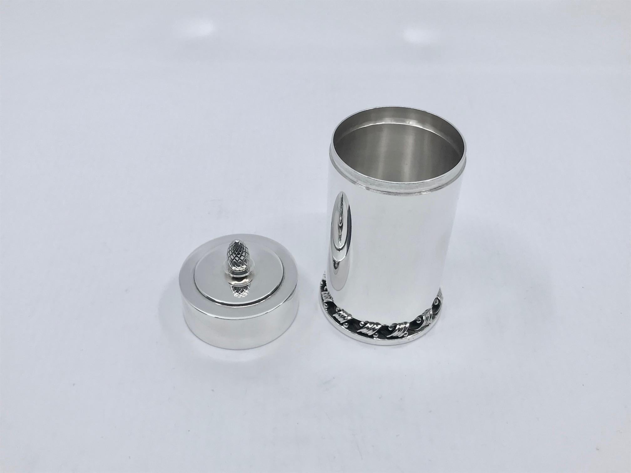 Sterling silver Georg Jensen Art Deco smokers set, including a cigarette box and matchstick stand, design #639 by Harald Nielsen from the early 1930s. The lid on the cigarette box is removable, the matchbox stand has an old matchbox which fits,