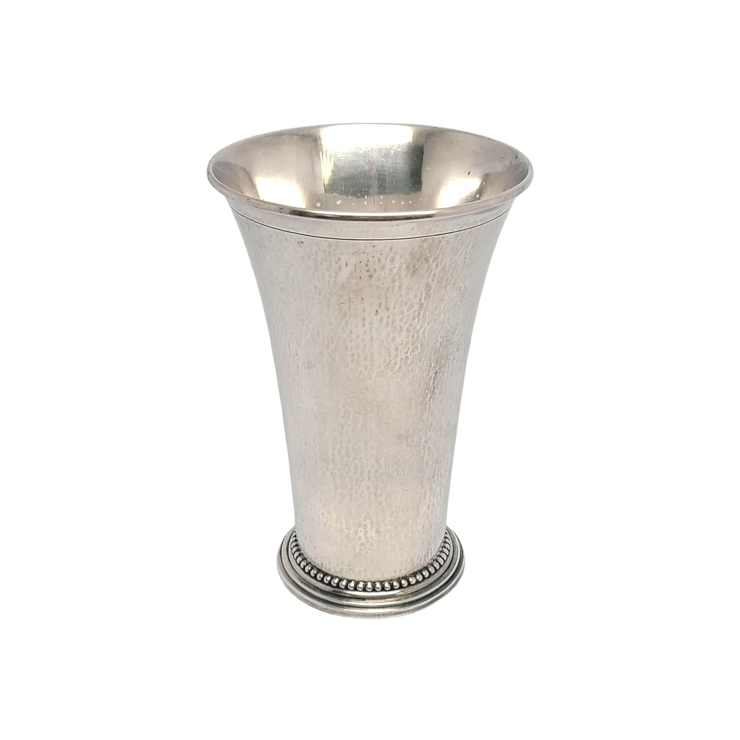 Vintage sterling silver beaker/tumbler cup/vase by Georg Jensen pattern #107B.

No monogram or engraving

This simple and elegant tumbler features a flare design with a lightly hammered finish and a stepped base with beaded edging.

Measures approx