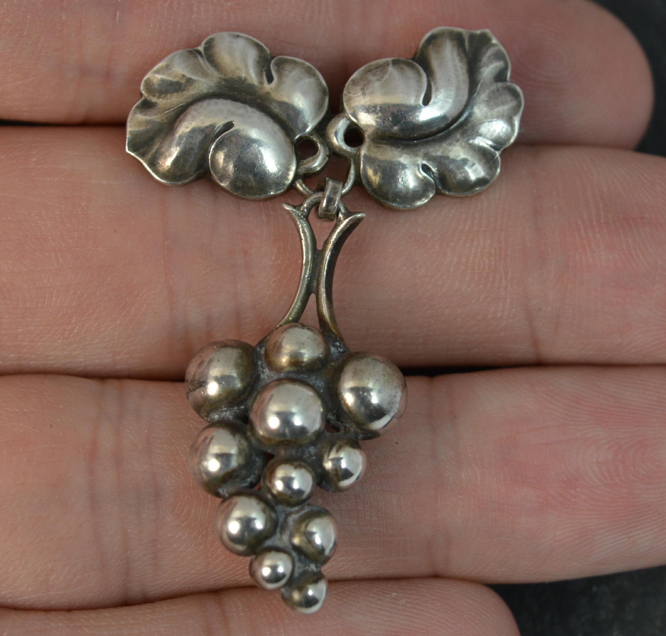 A very rare vintage Georg Jensen Sterling Silver pin brooch.

Solid silver, 217a model number. Beautiful grape drop design.

Moonlight Grape piece.

Hallmarks ; Georg Jensen, 925s Denmark, 217a
Weight ; 6.8 grams
Size ; 28mm x 43mm approx
Condition