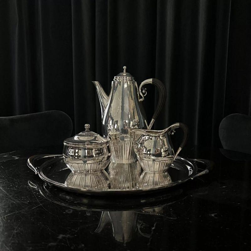 A three-piece sterling silver Georg Jensen coffee set with ebony handles, design #45 by Johan Rohde from circa 1915. This design is often referred to as the “Cosmos” design.

Additional information:
Material: Sterling silver
Styles: Art
