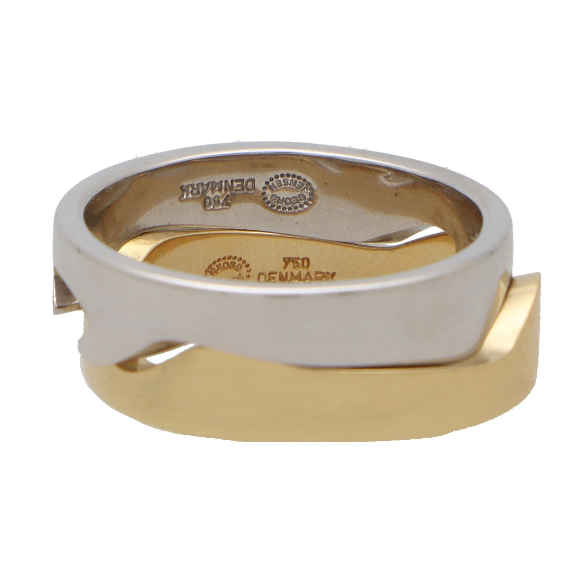  A rather interesting vintage Georg Jensen two piece Fusion puzzle ring set in solid 18k yellow and white gold.

This unique piece is composed of two different coloured gold bands each of which having their own unique grooved pattern. These patterns
