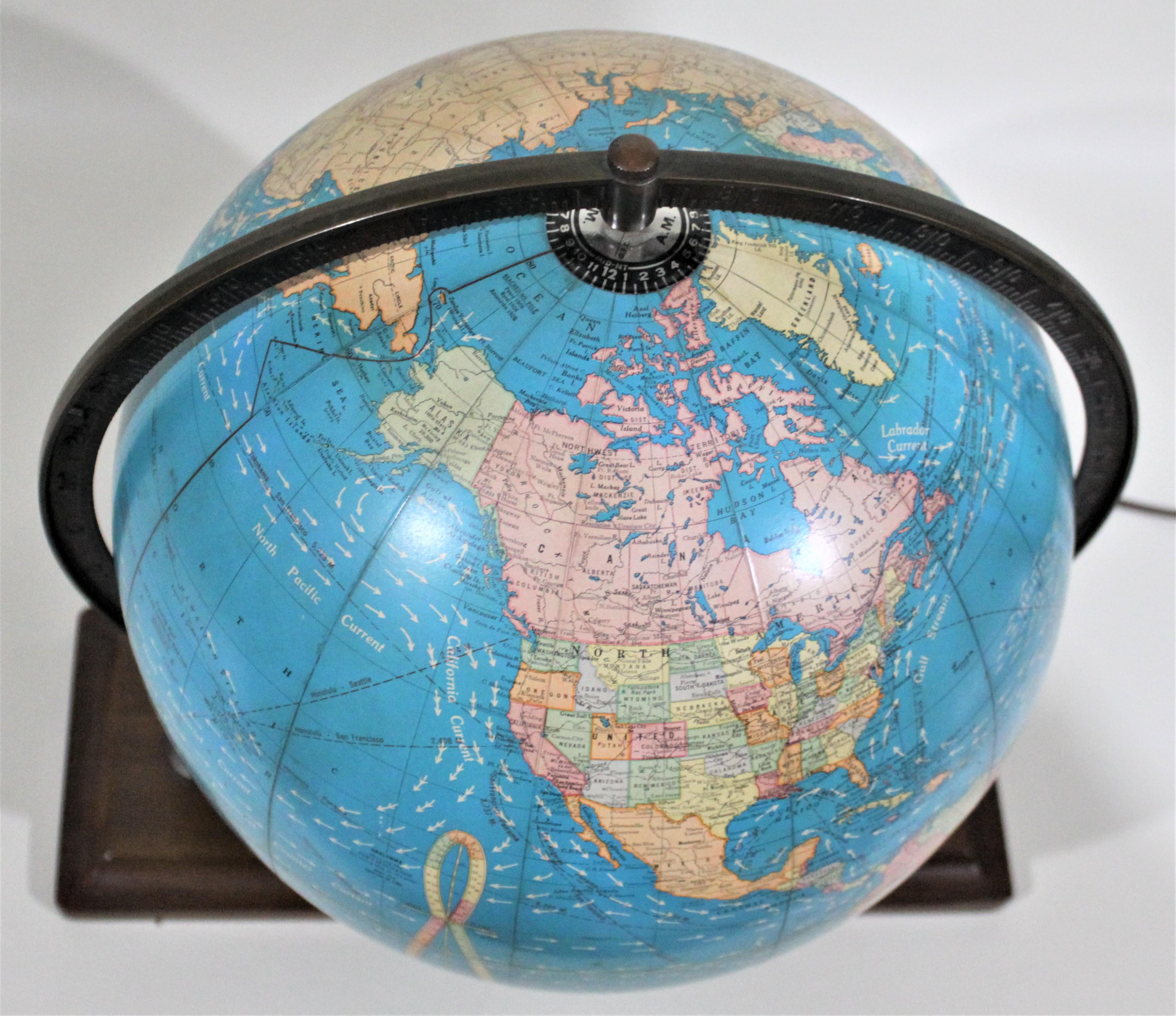 20th Century Vintage George F. Cram Co. Figural Brass Atlas Illuminated Terrestrial Globe