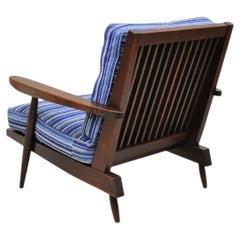 Poltrona da salotto vintage "Cushion" di George Nakashima con schienale a sponde in noce nero